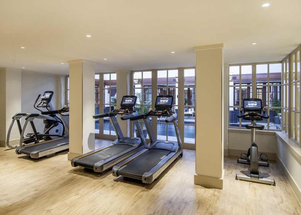 a room with treadmills and exercise machines