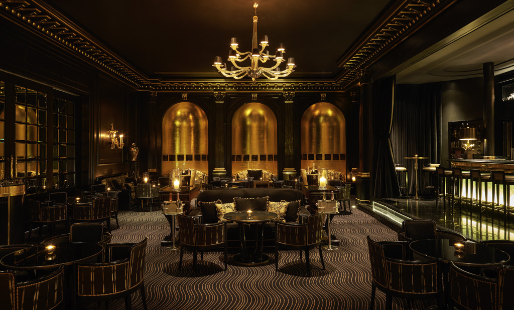 a room with a chandelier and tables