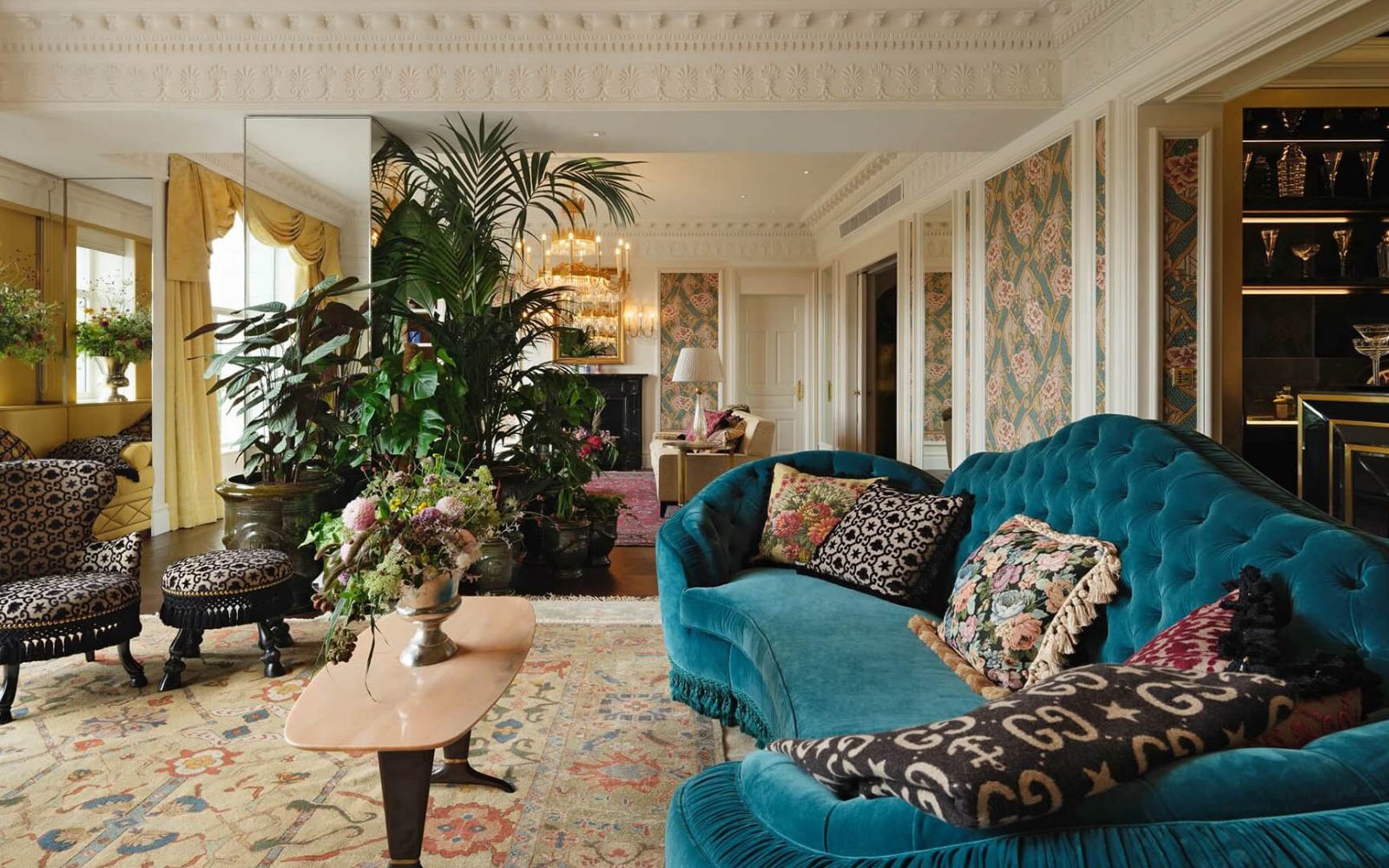 a living room with a blue couch and a coffee table