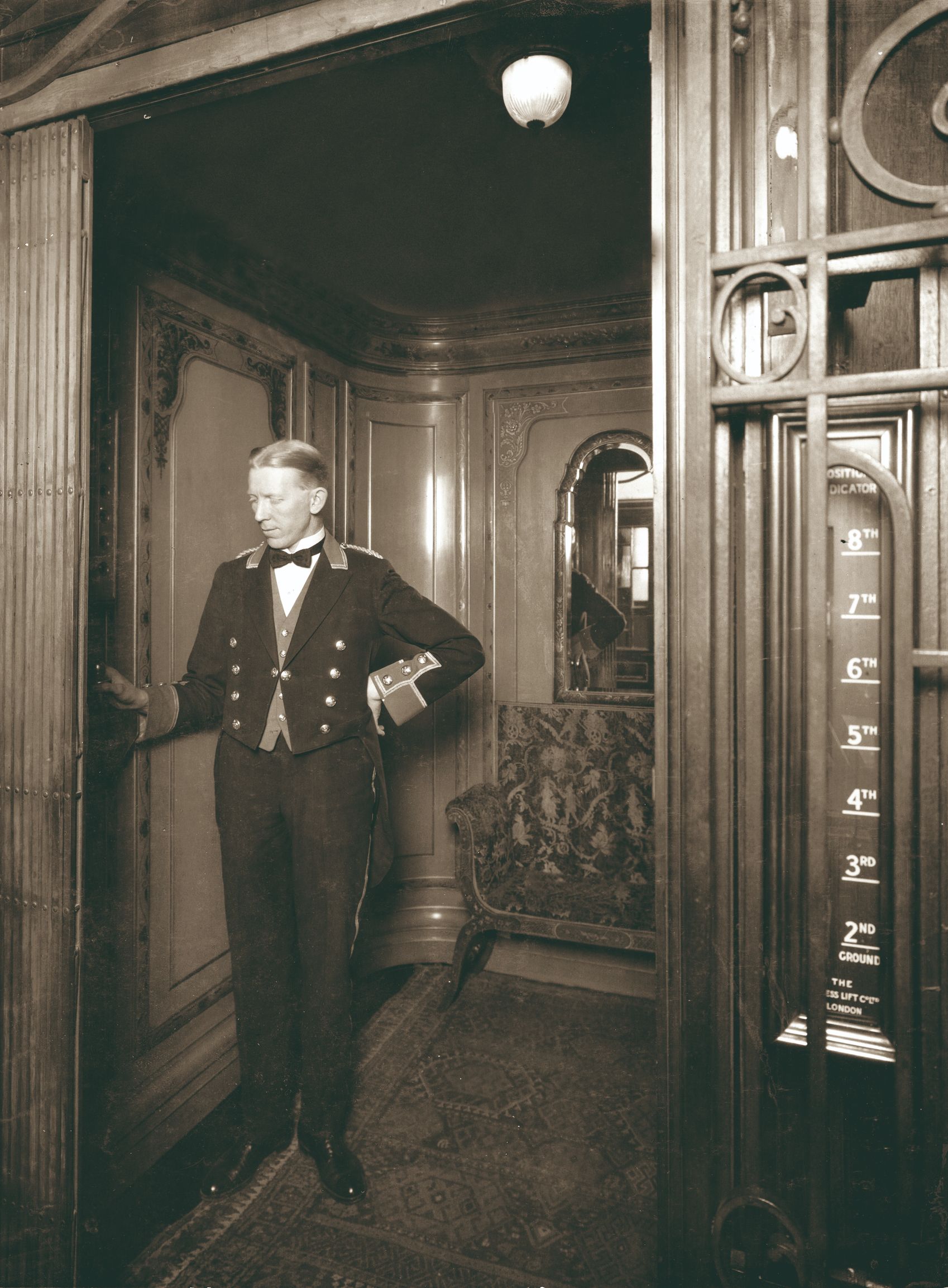 a man in a uniform standing in a room