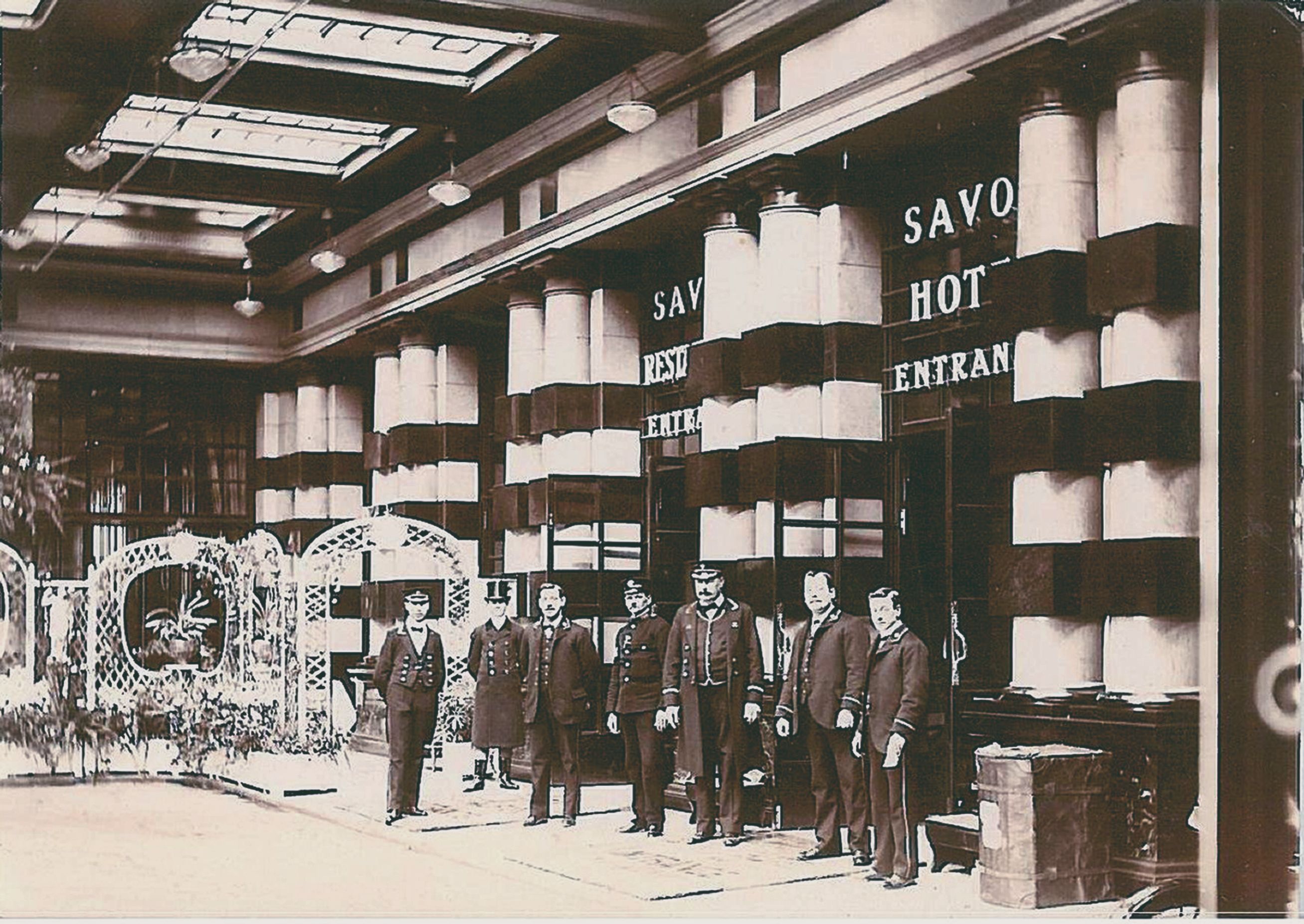 a group of men standing in front of a building