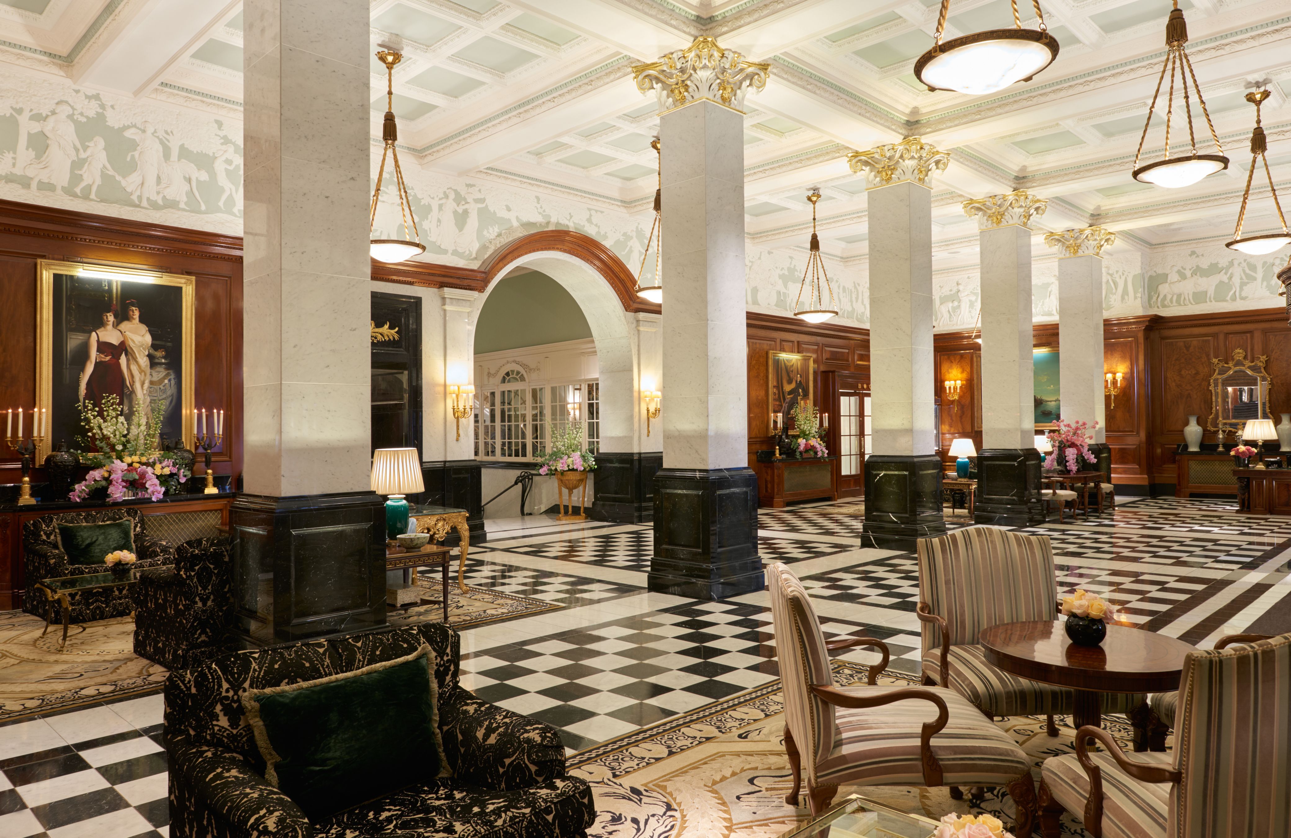 a large room with black and white columns and chairs