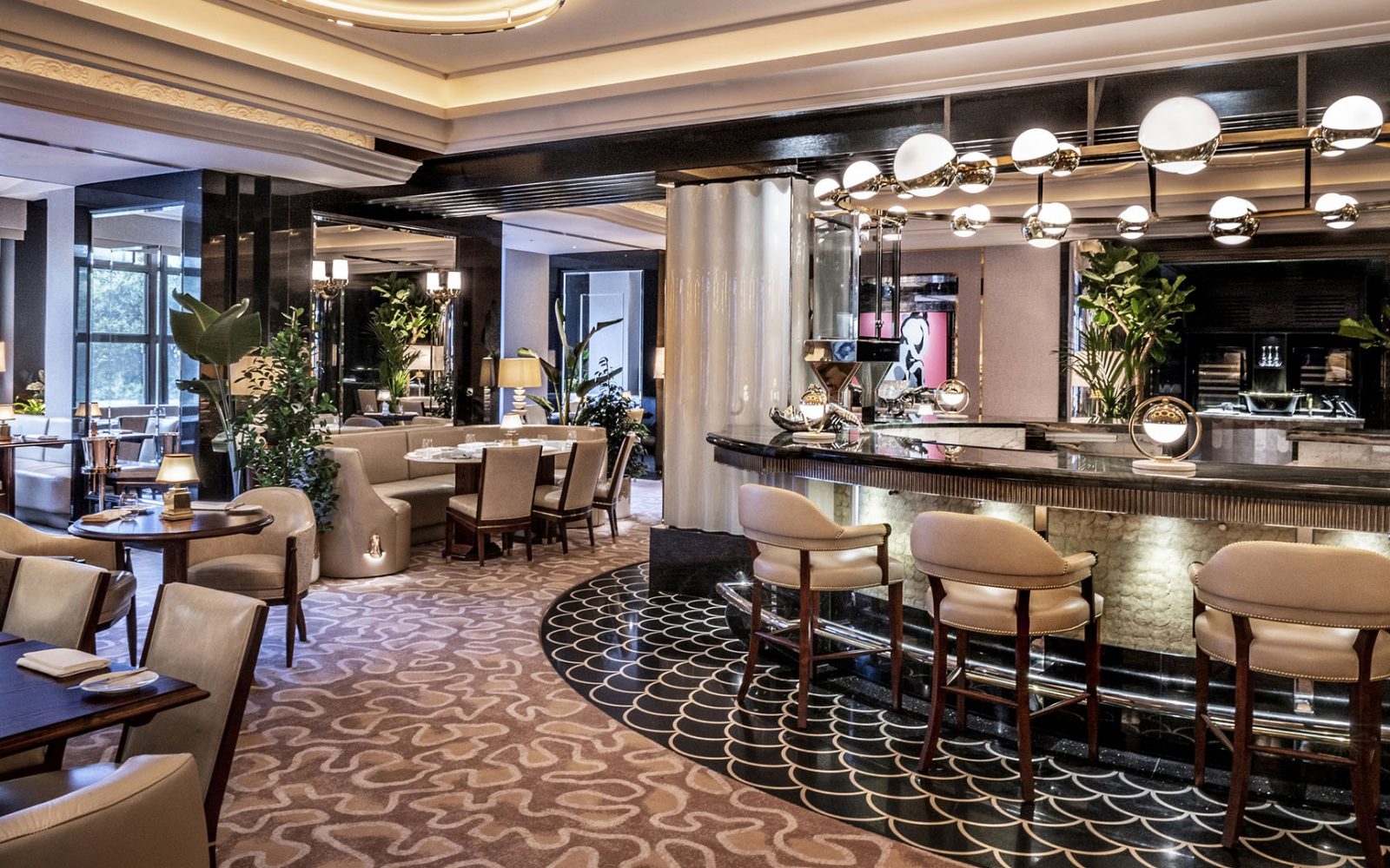 a room with a bar and chairs