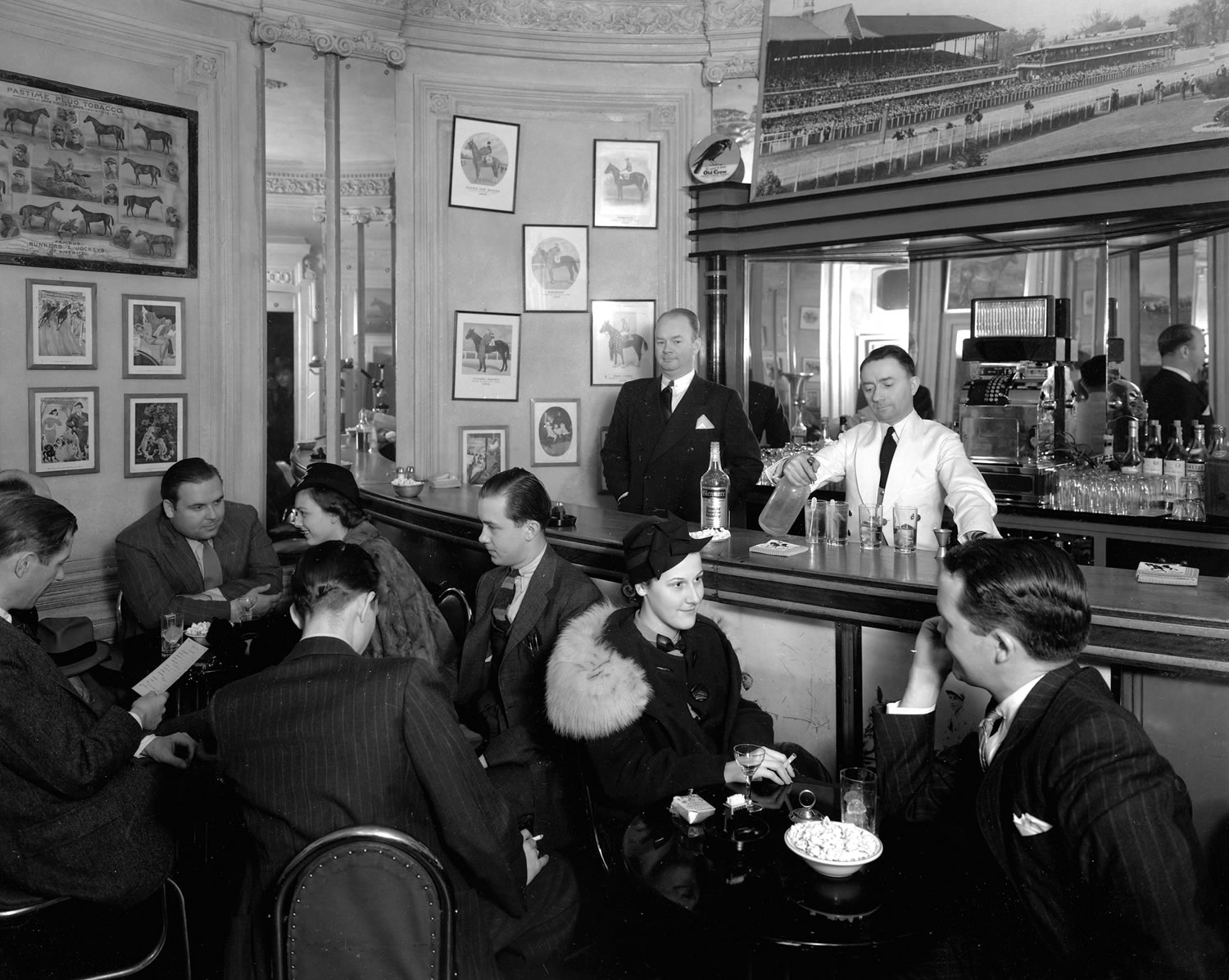 a group of people sitting at a bar