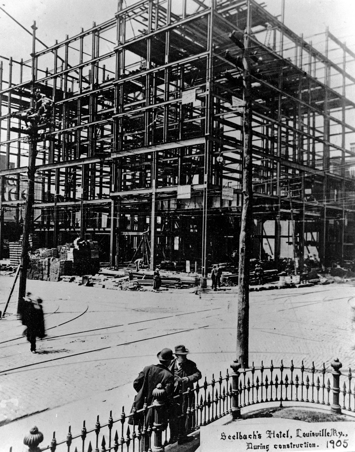 a construction site with people walking