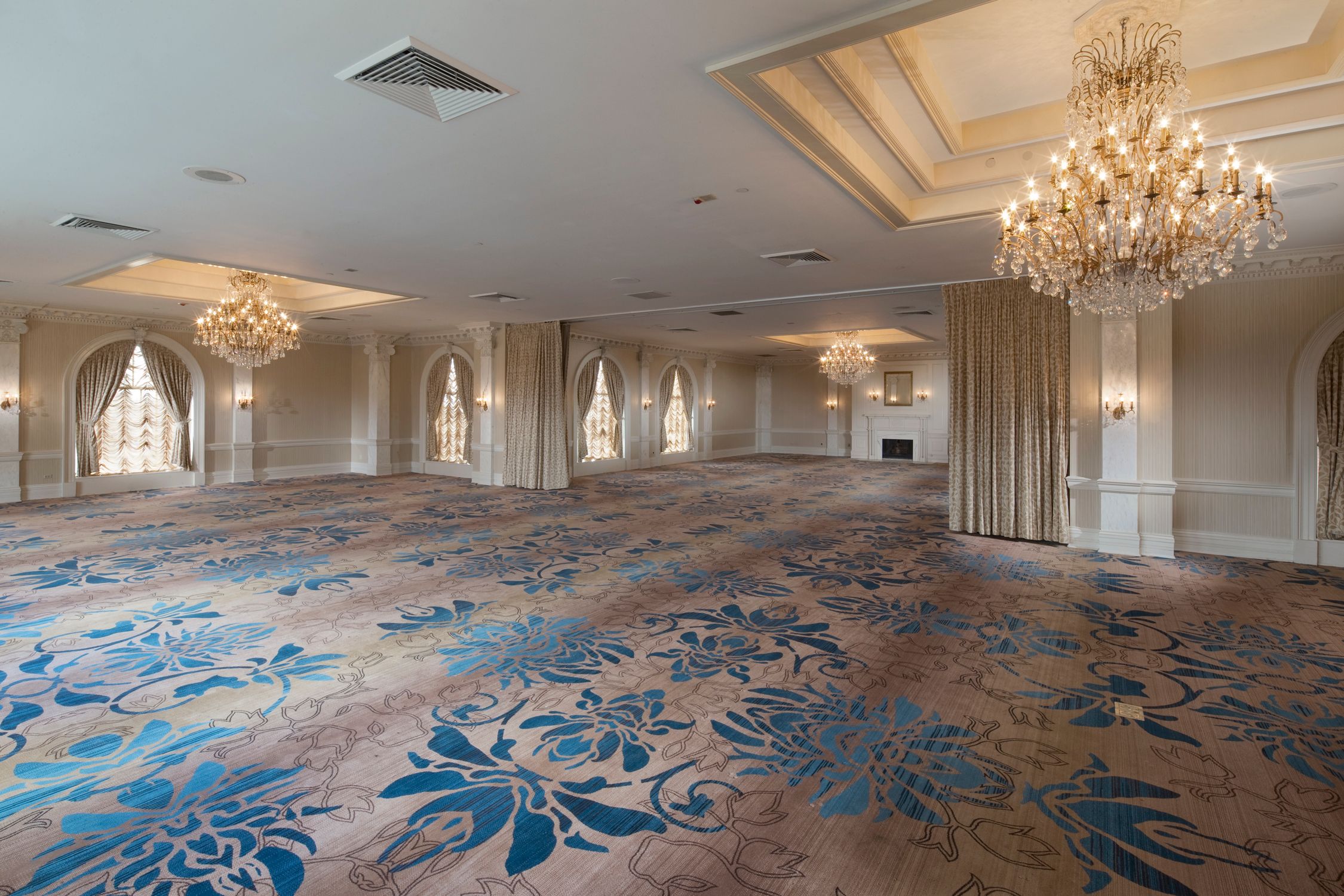 a large room with chandeliers and carpet
