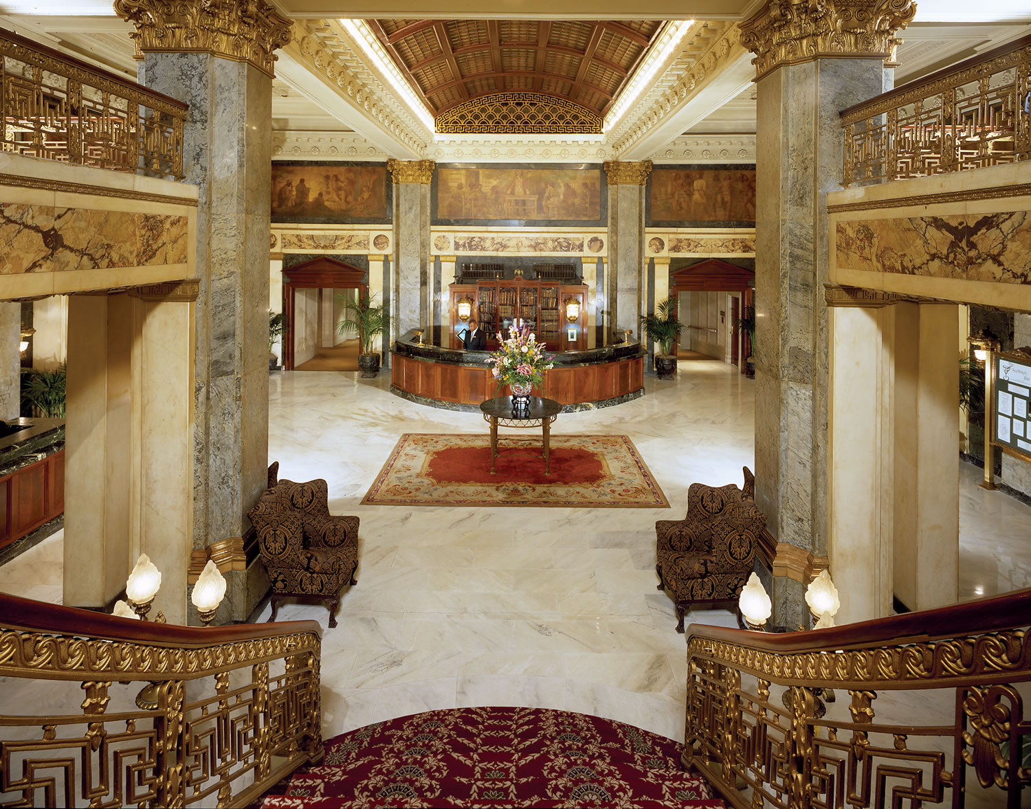 a lobby with a table and chairs