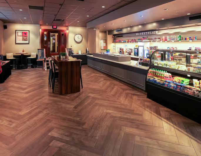 a room with a counter and a drink case