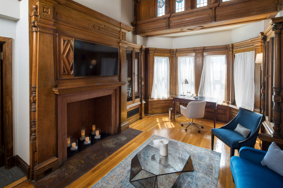 a room with a fireplace and a tv