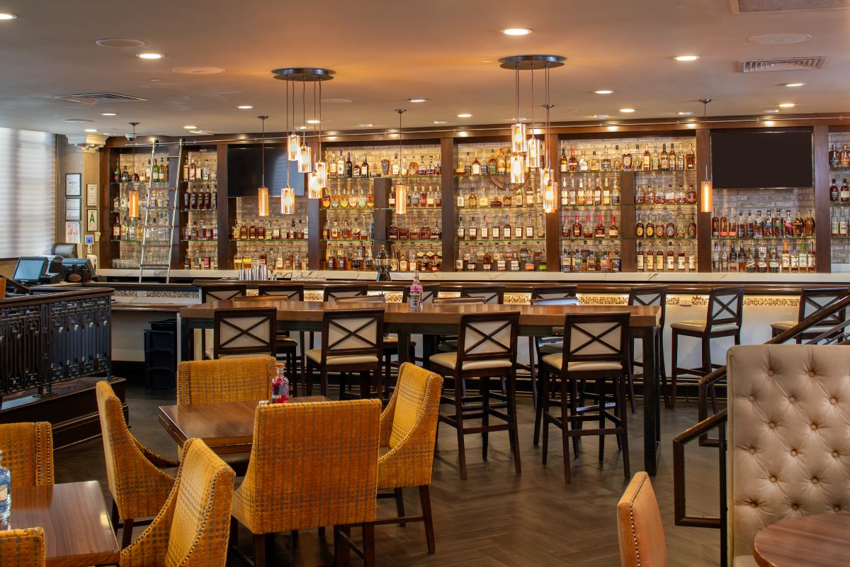 a bar with a table and chairs