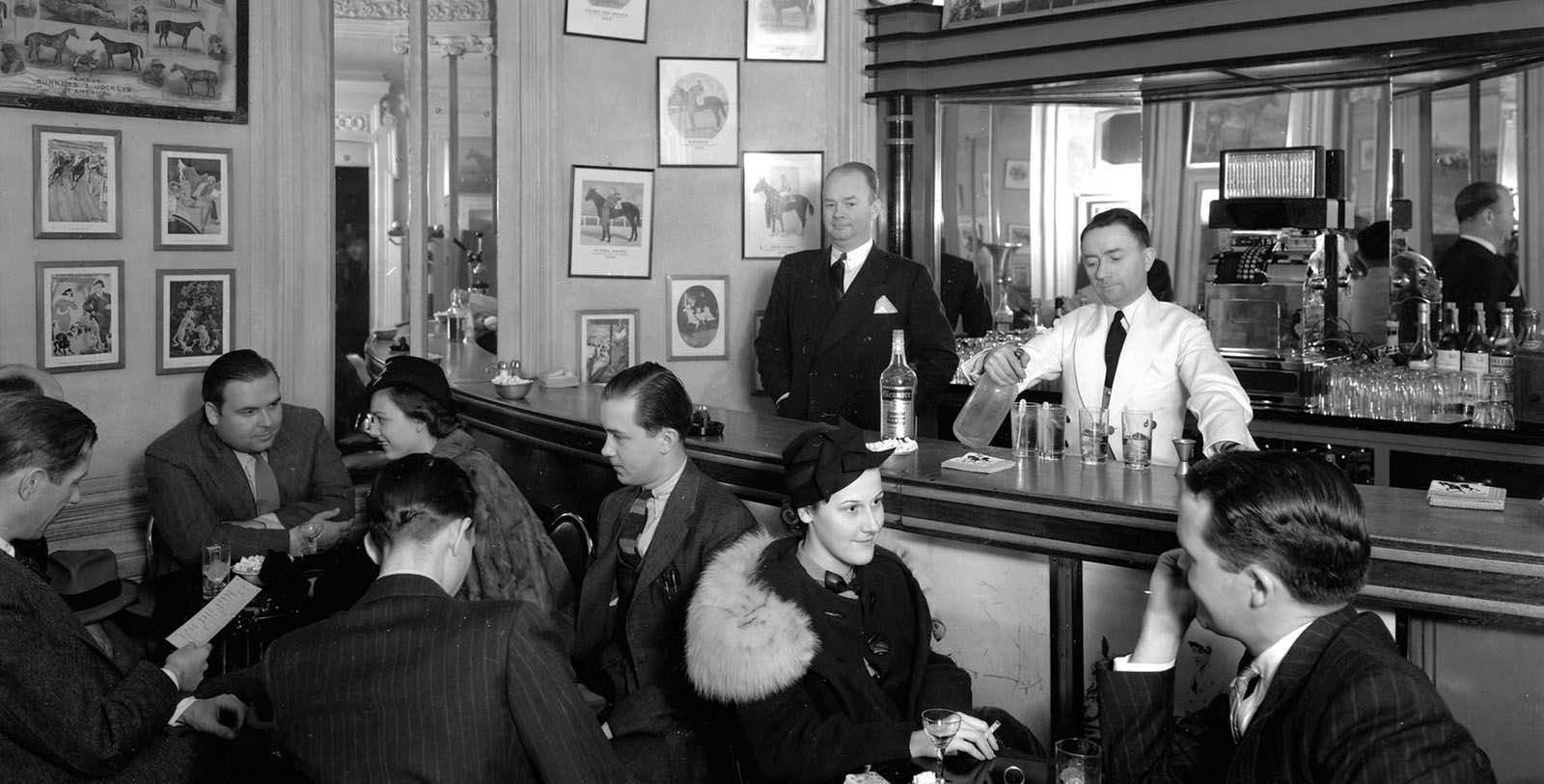 a group of people sitting at a bar
