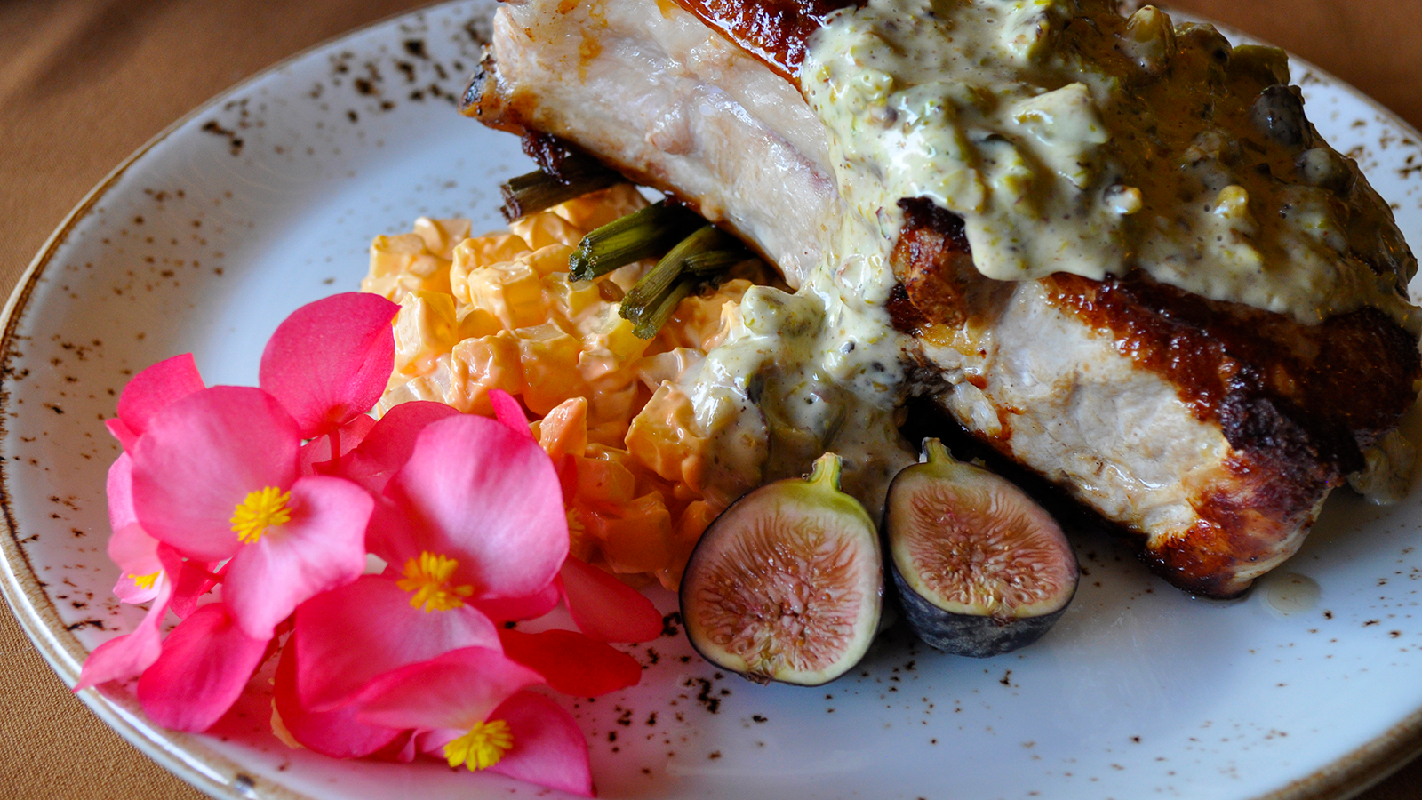 the settlers inn  liedys sustainably raised pork chops pistachio cream rainbow carrots and fresh figs