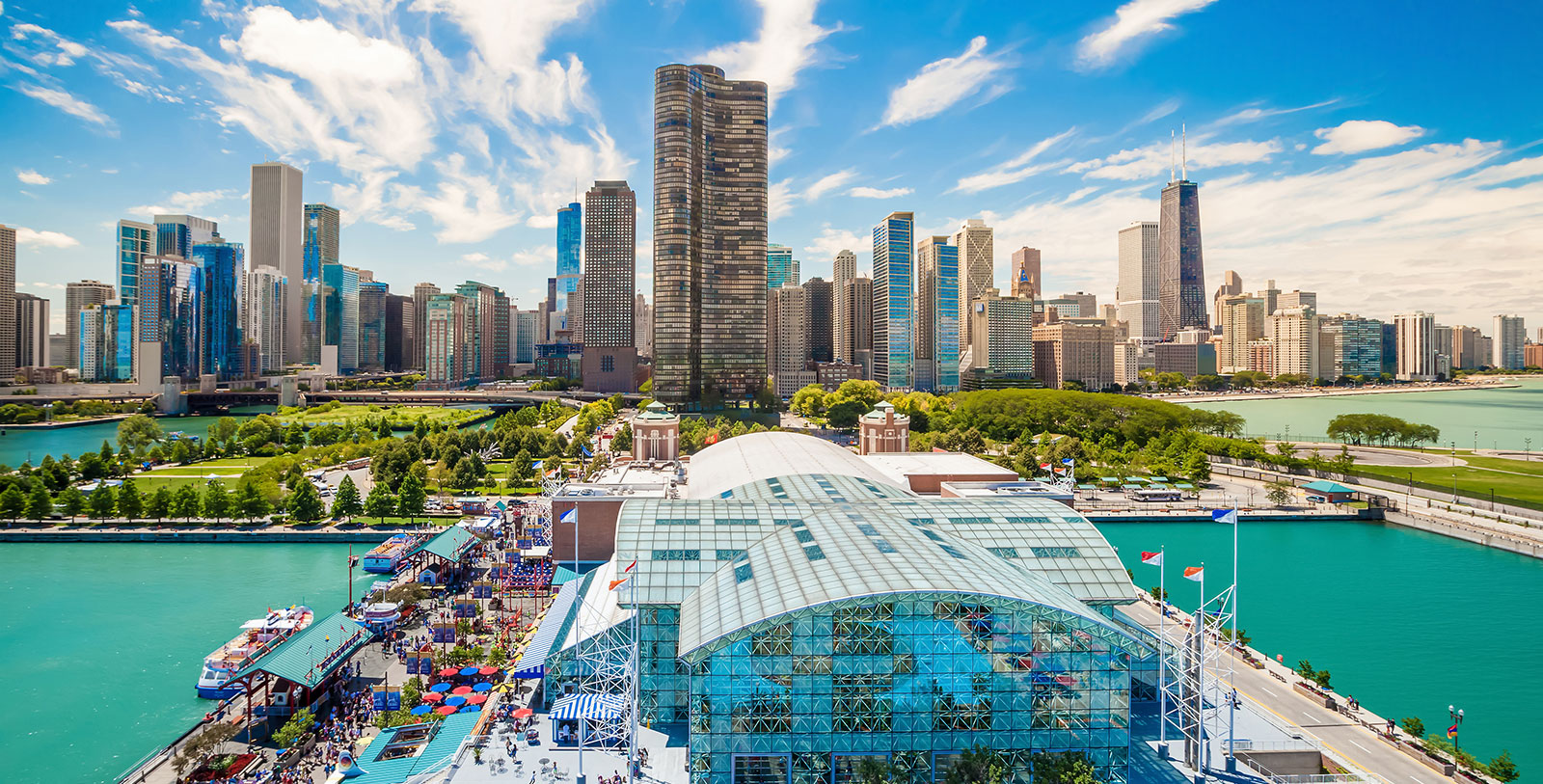 a city skyline with a glass roof and a park