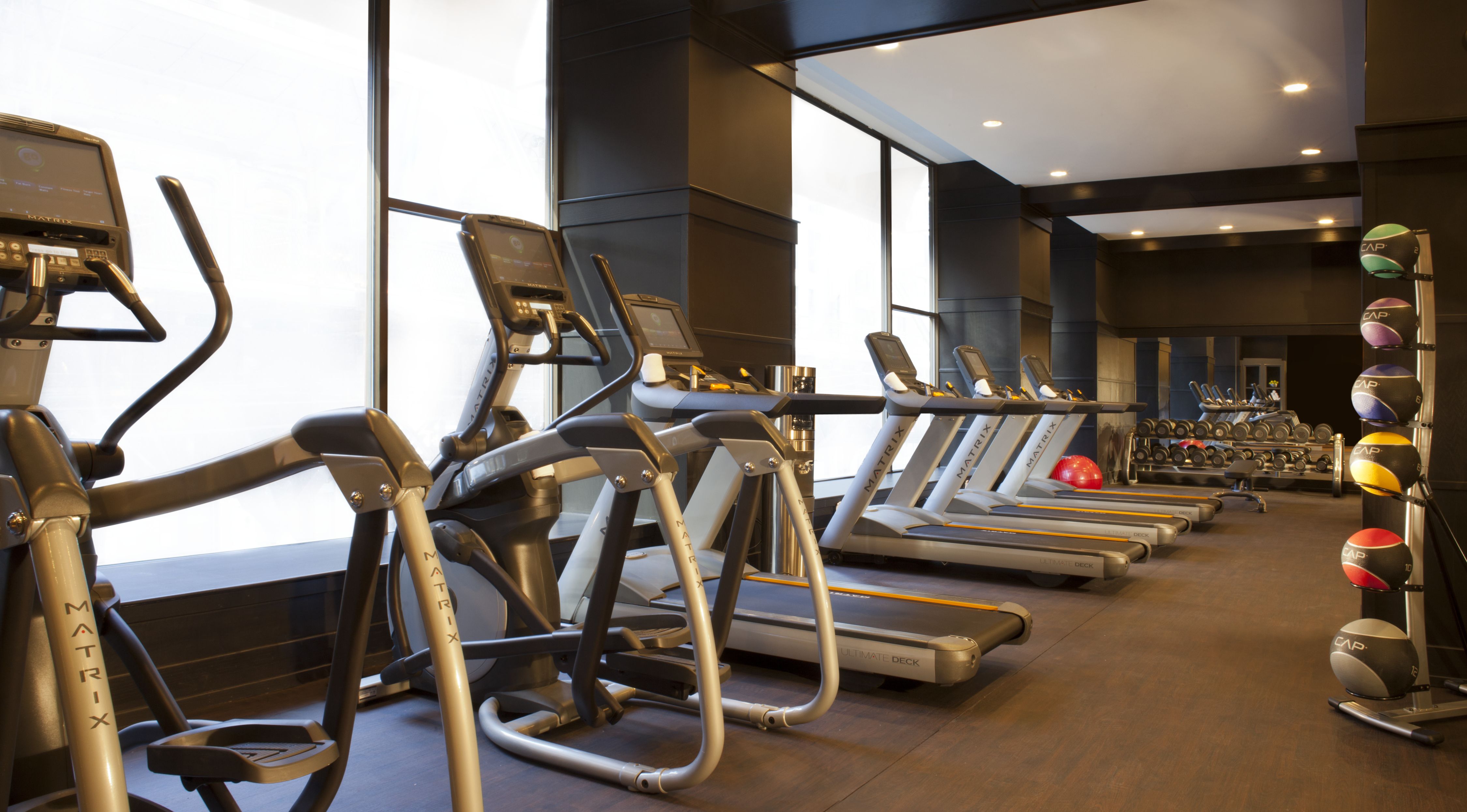 a group of treadmills in a gym