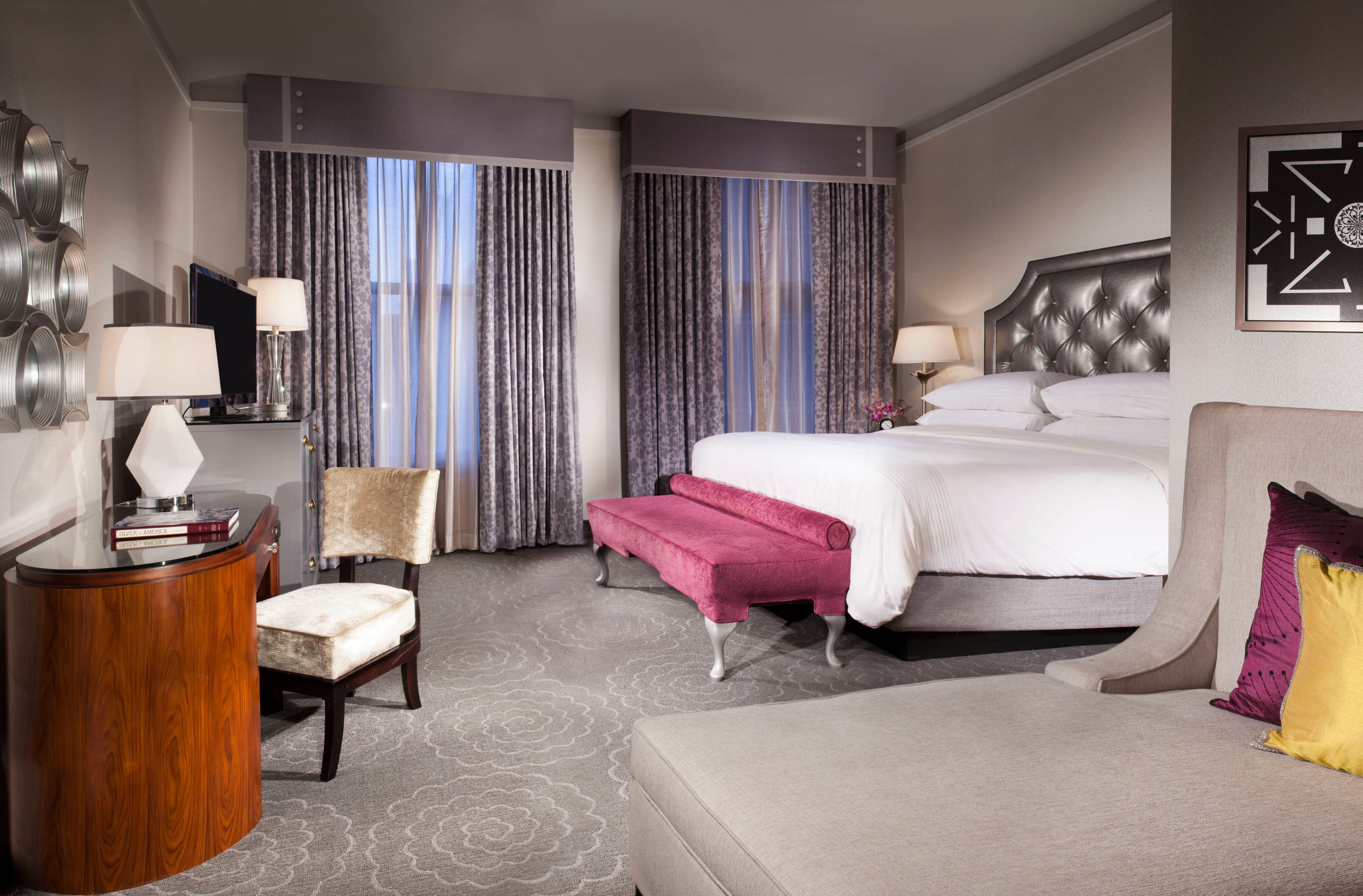 a room with a bed and a desk