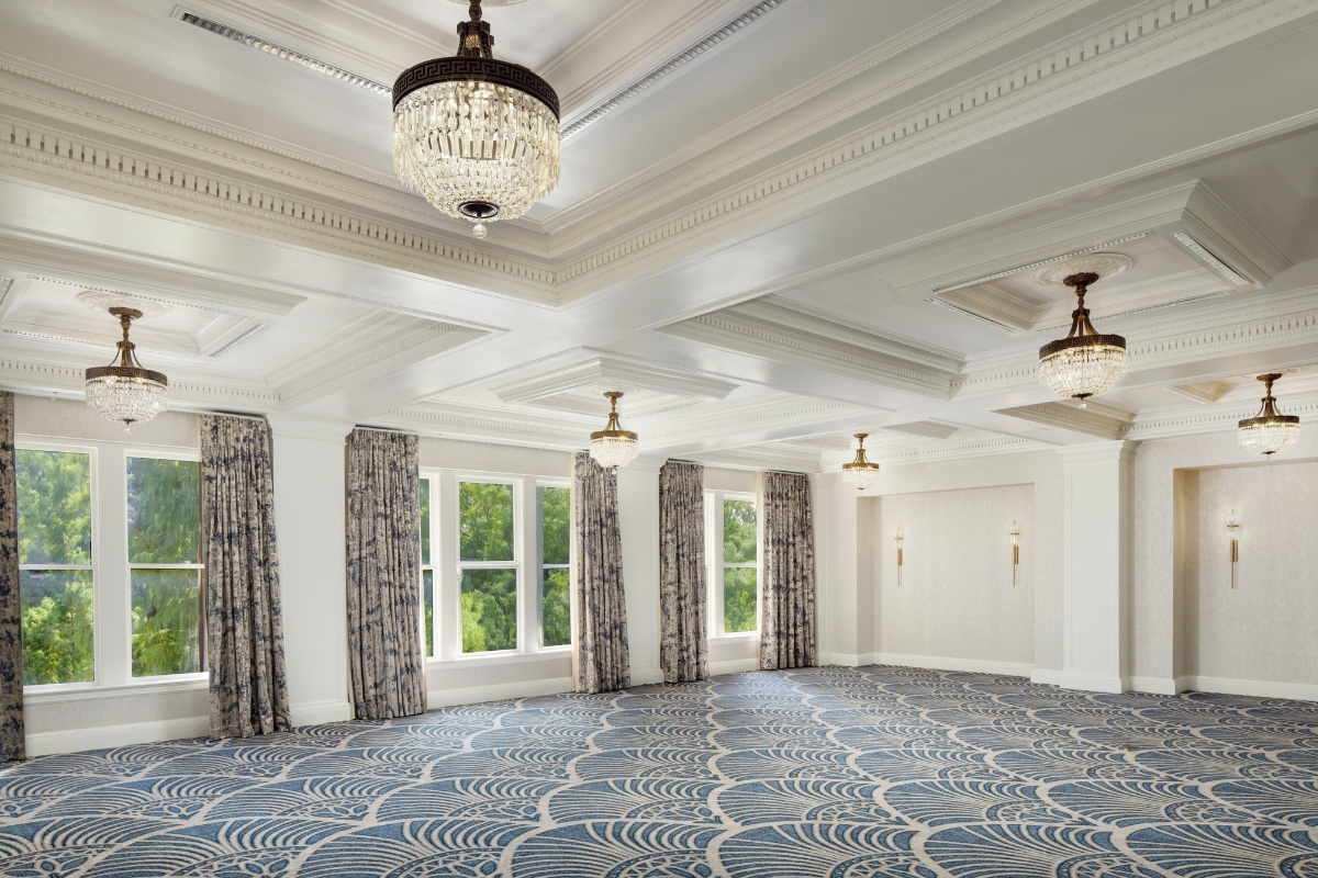 a room with a chandelier and curtains
