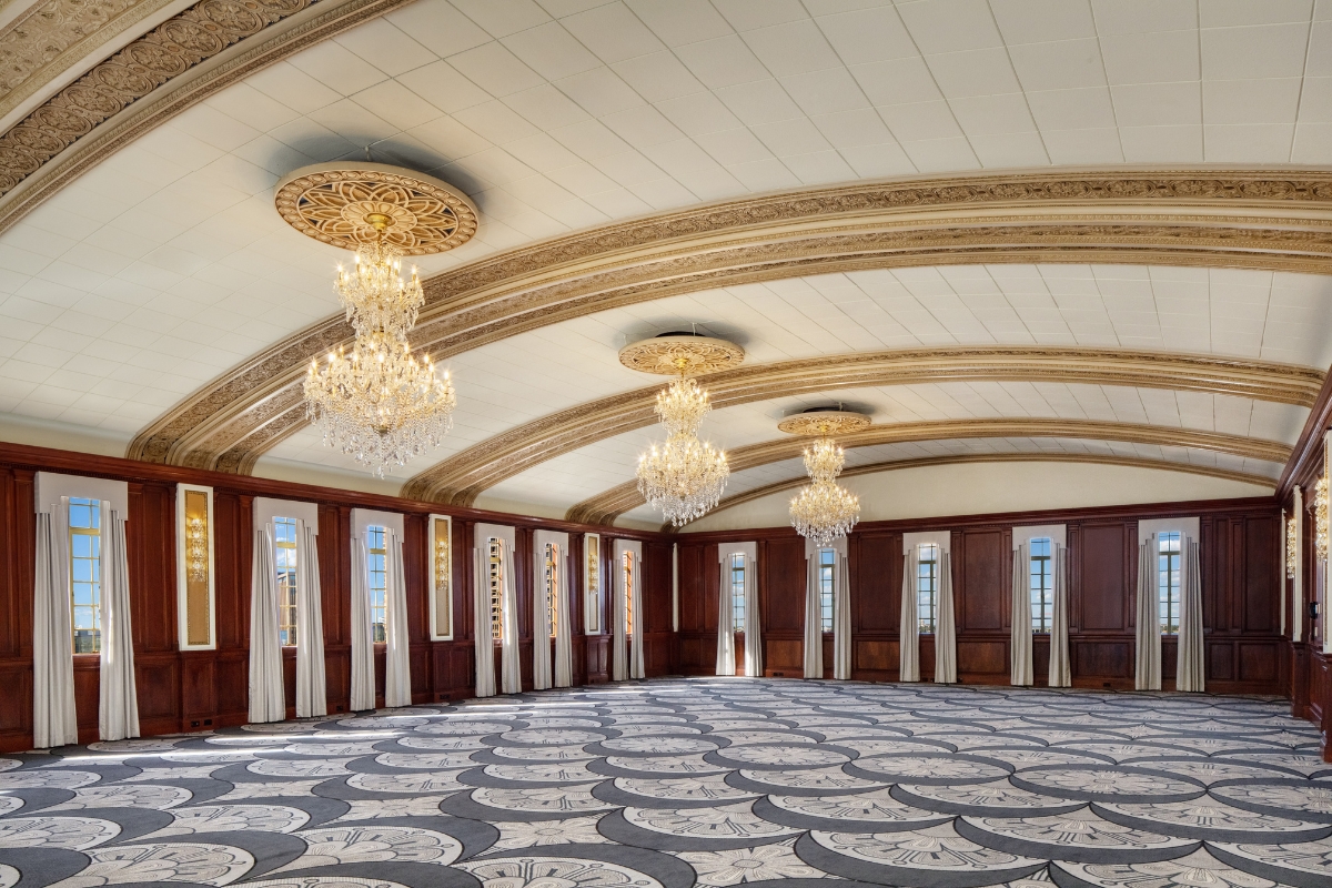 a large room with chandeliers and carpet