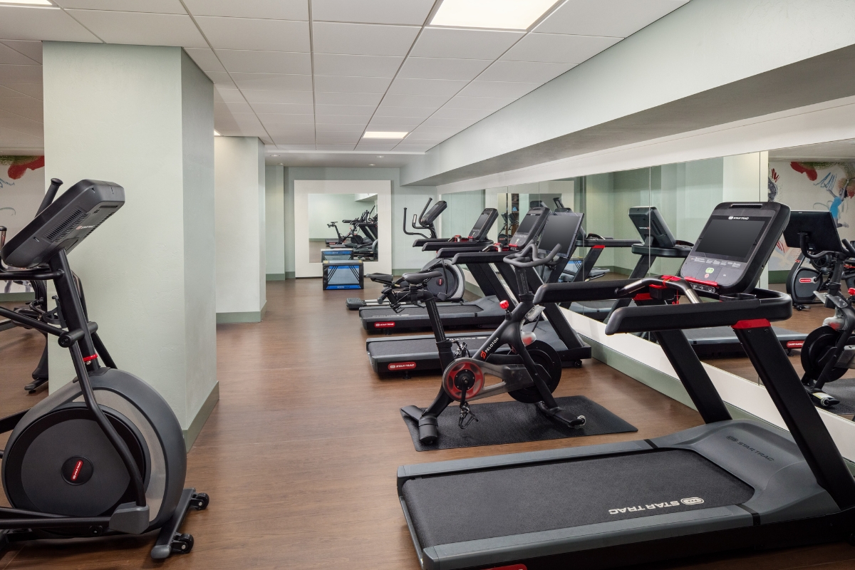 a room with treadmills and exercise machines