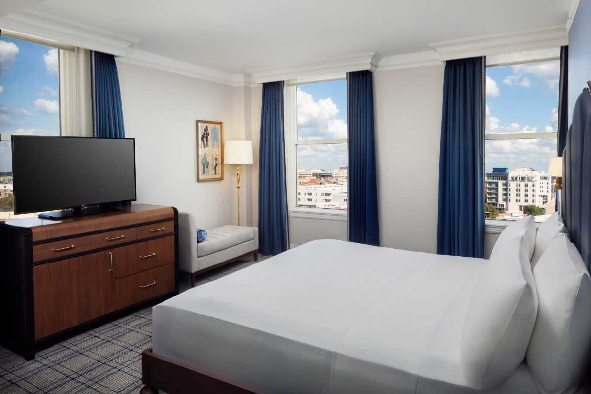 a room with a bed and a tv