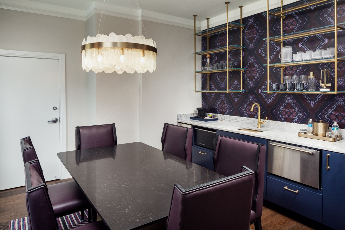 a dining table with chairs in a room