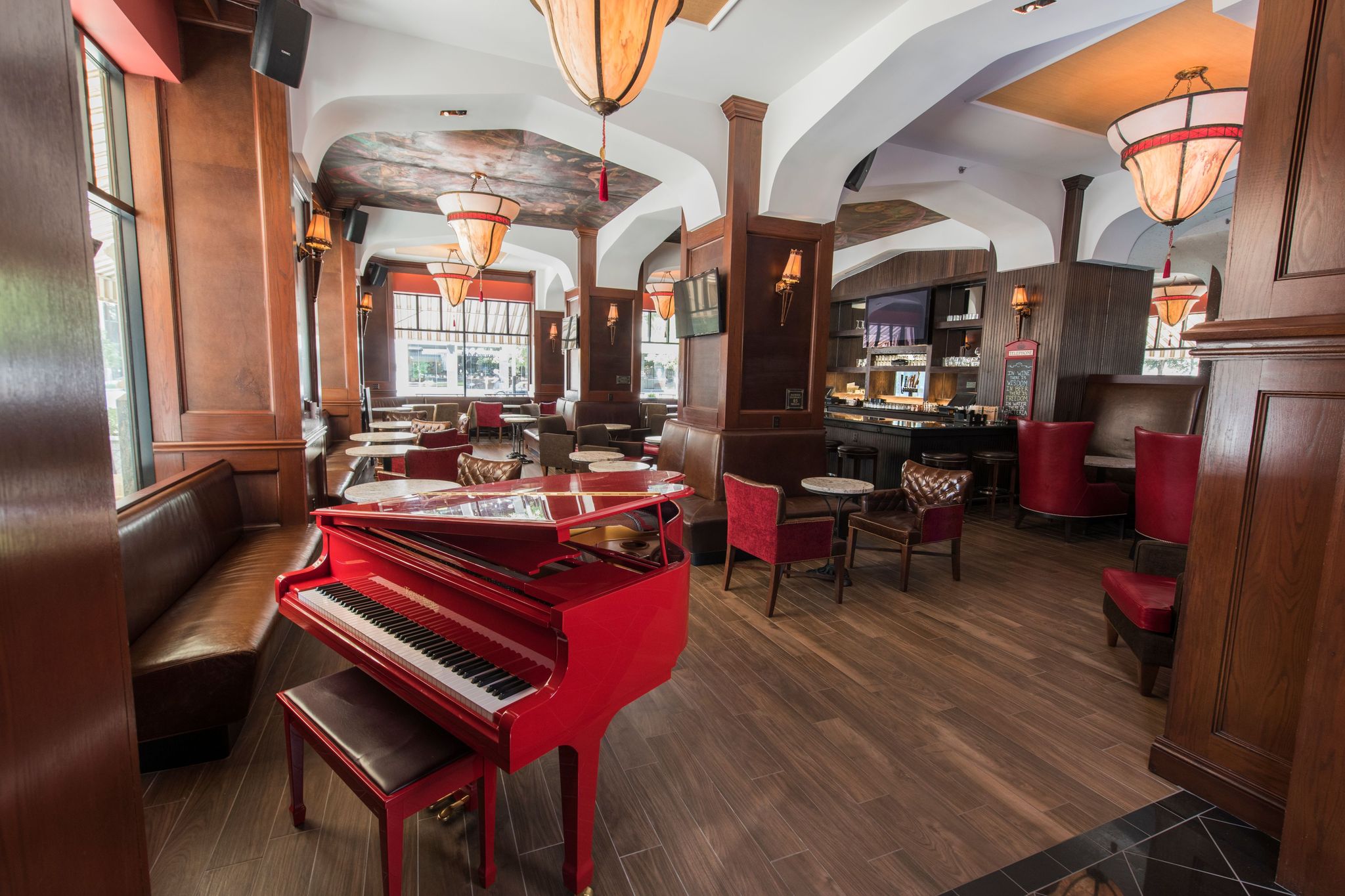 a red piano in a restaurant
