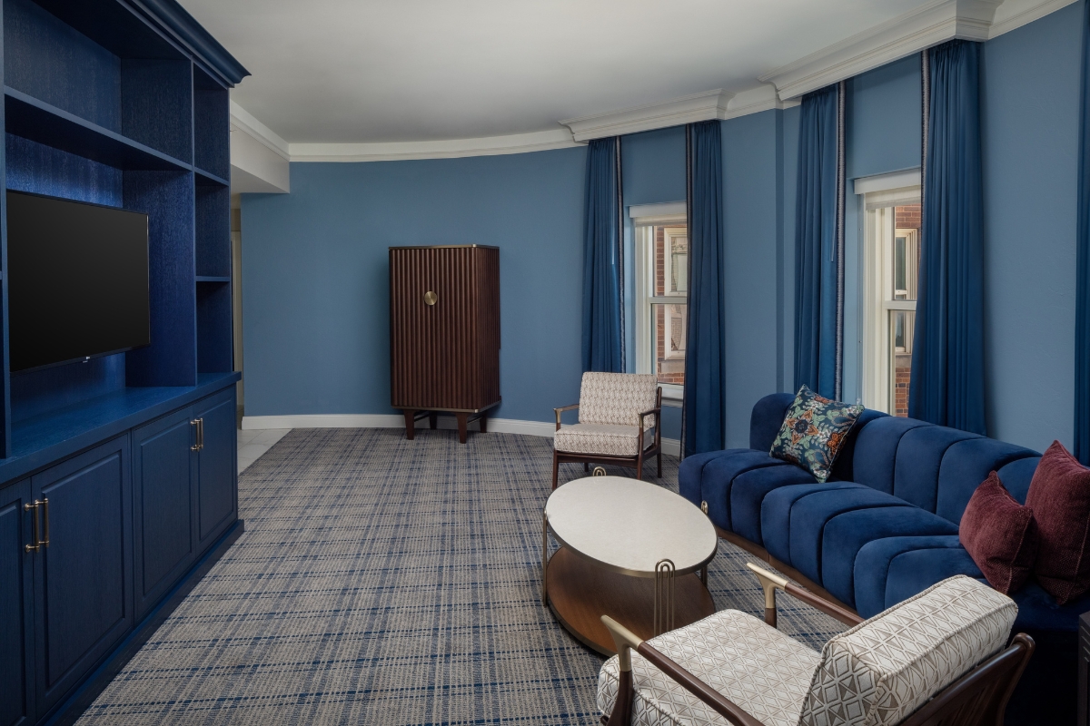 a room with blue walls and a couch and a table
