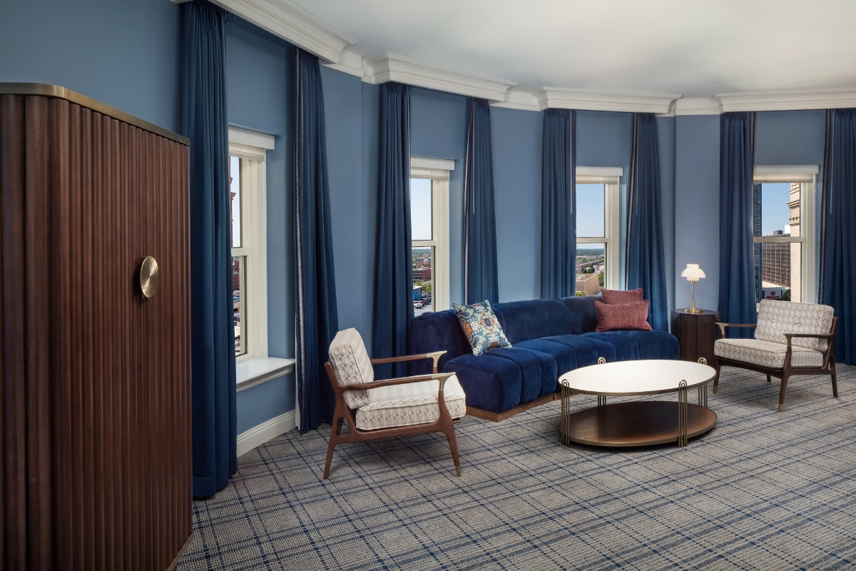 a room with blue walls and a couch and a coffee table