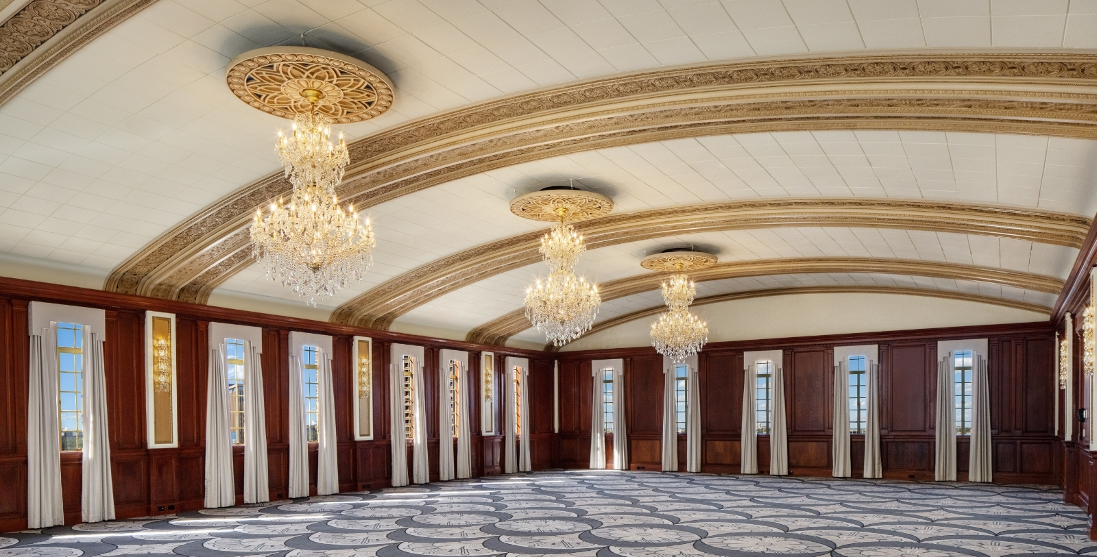 a large room with chandeliers and carpet