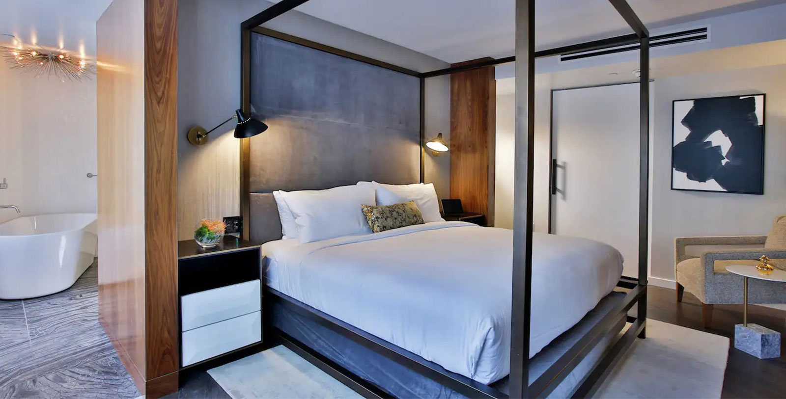 a bed with a four poster bed