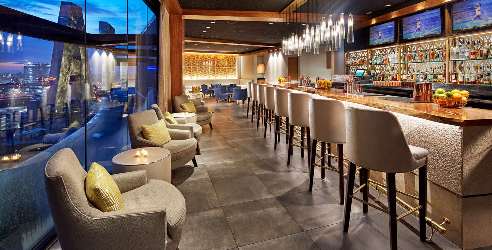 a bar with chairs and tables