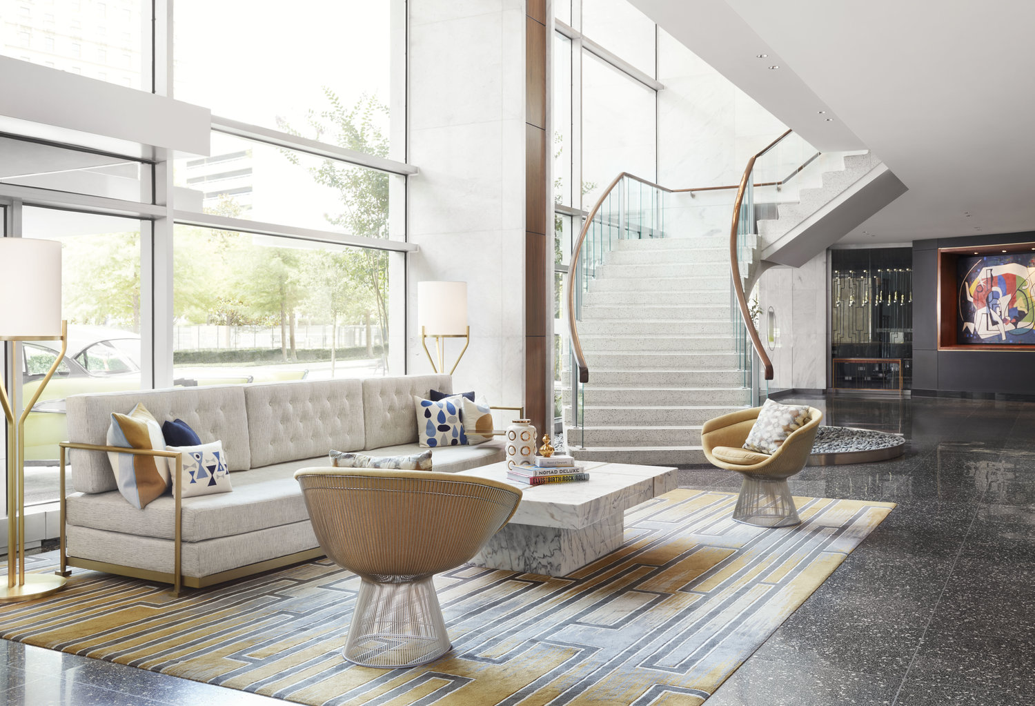 a room with a marble table and chairs