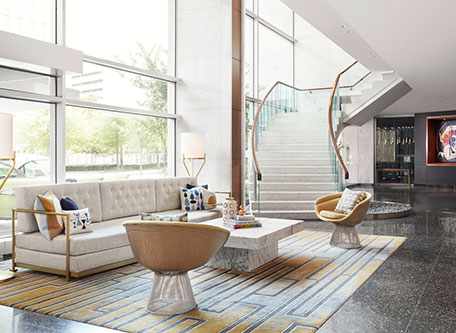 a room with a staircase and a couch