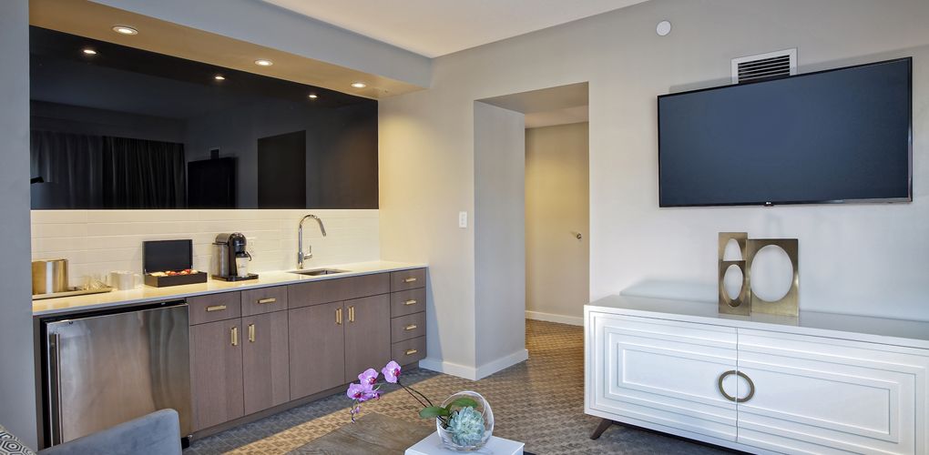 a kitchen with a tv on the wall