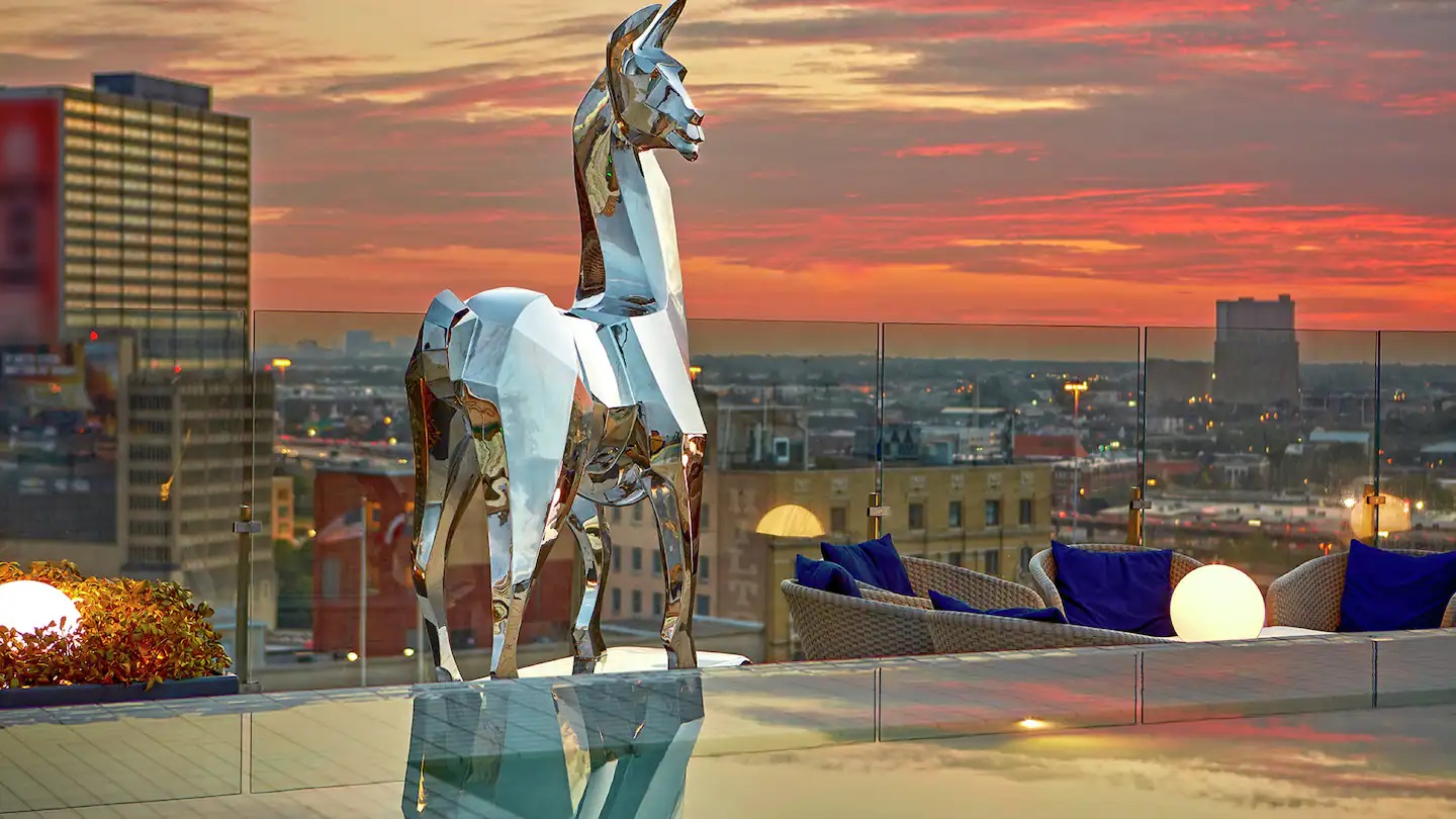 a statue of a horse on a rooftop
