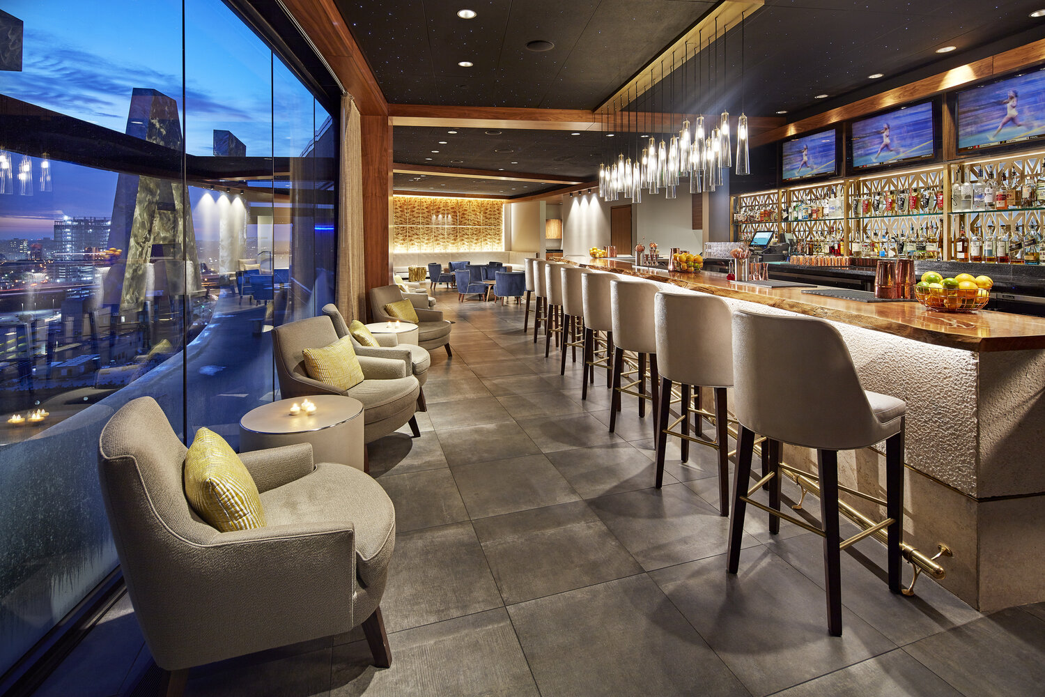 a bar with chairs and tables