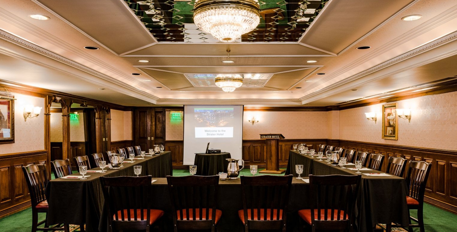a room with a large table and chairs