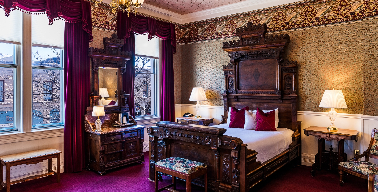 a bedroom with a bed and a mirror