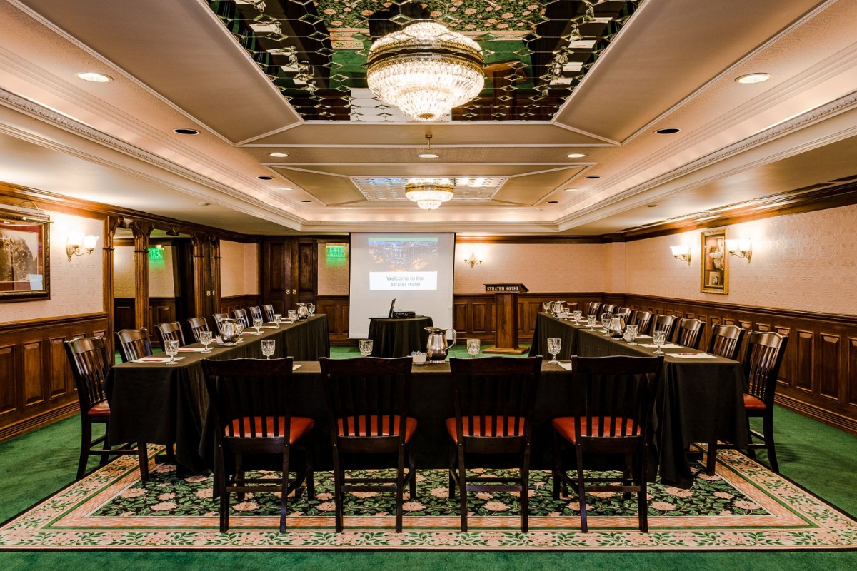 a room with a large table and chairs