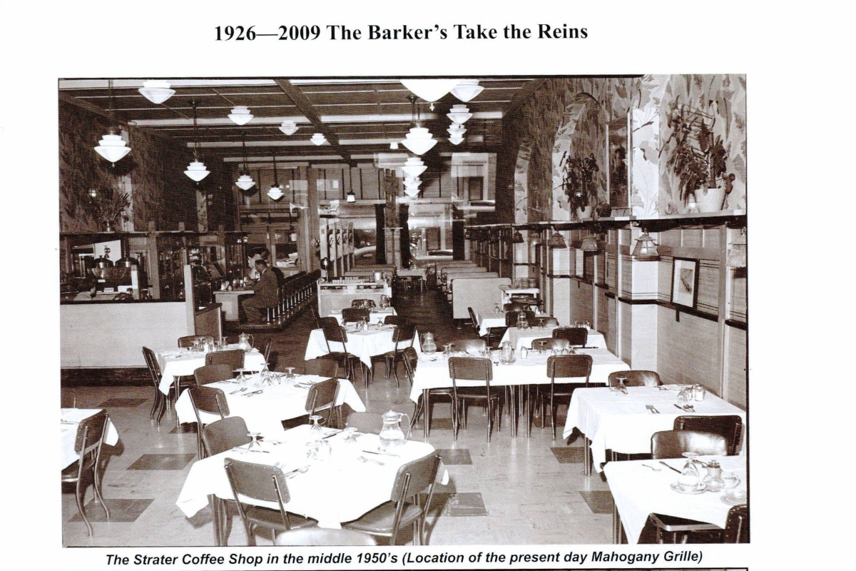 a black and white photo of a man and a woman at a bar