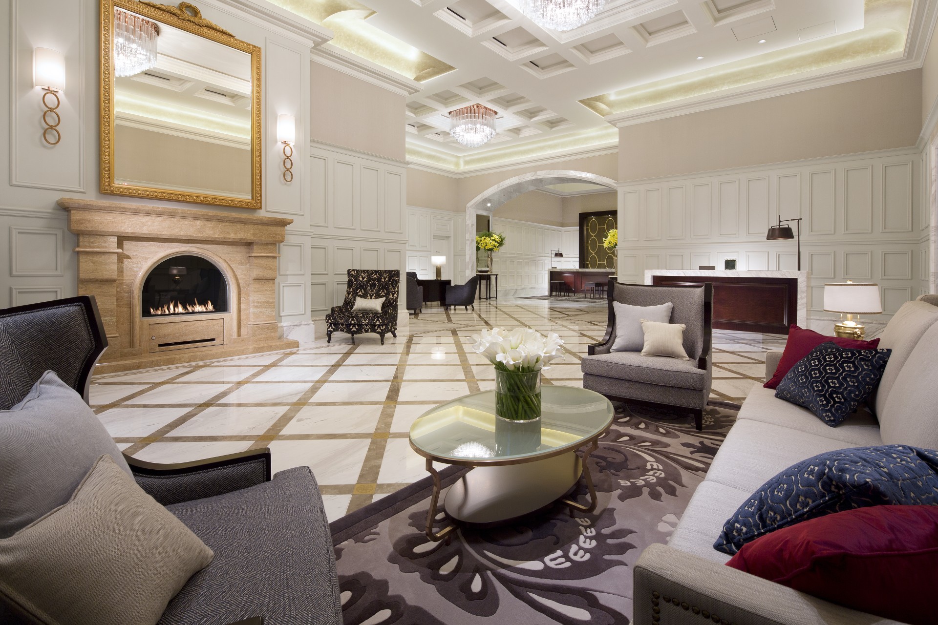 a room with a fireplace and couches
