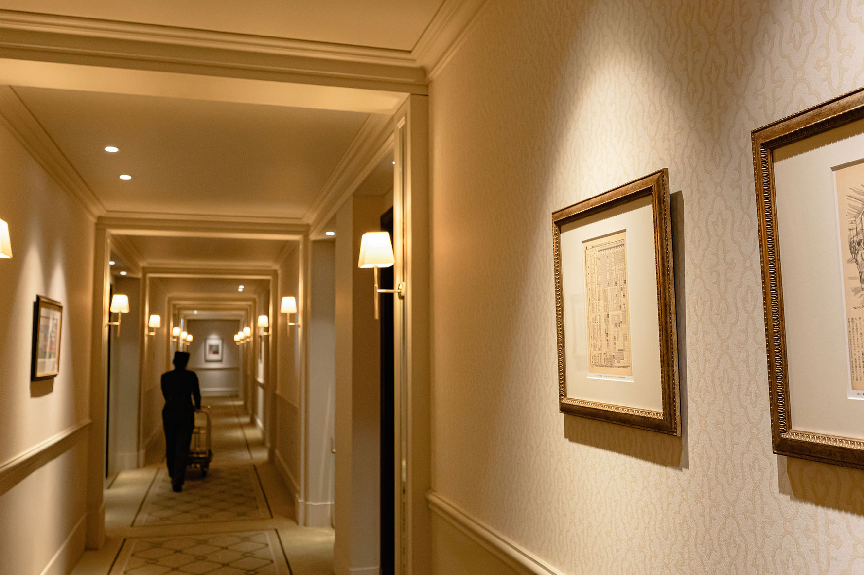 a hallway with a framed picture on the wall