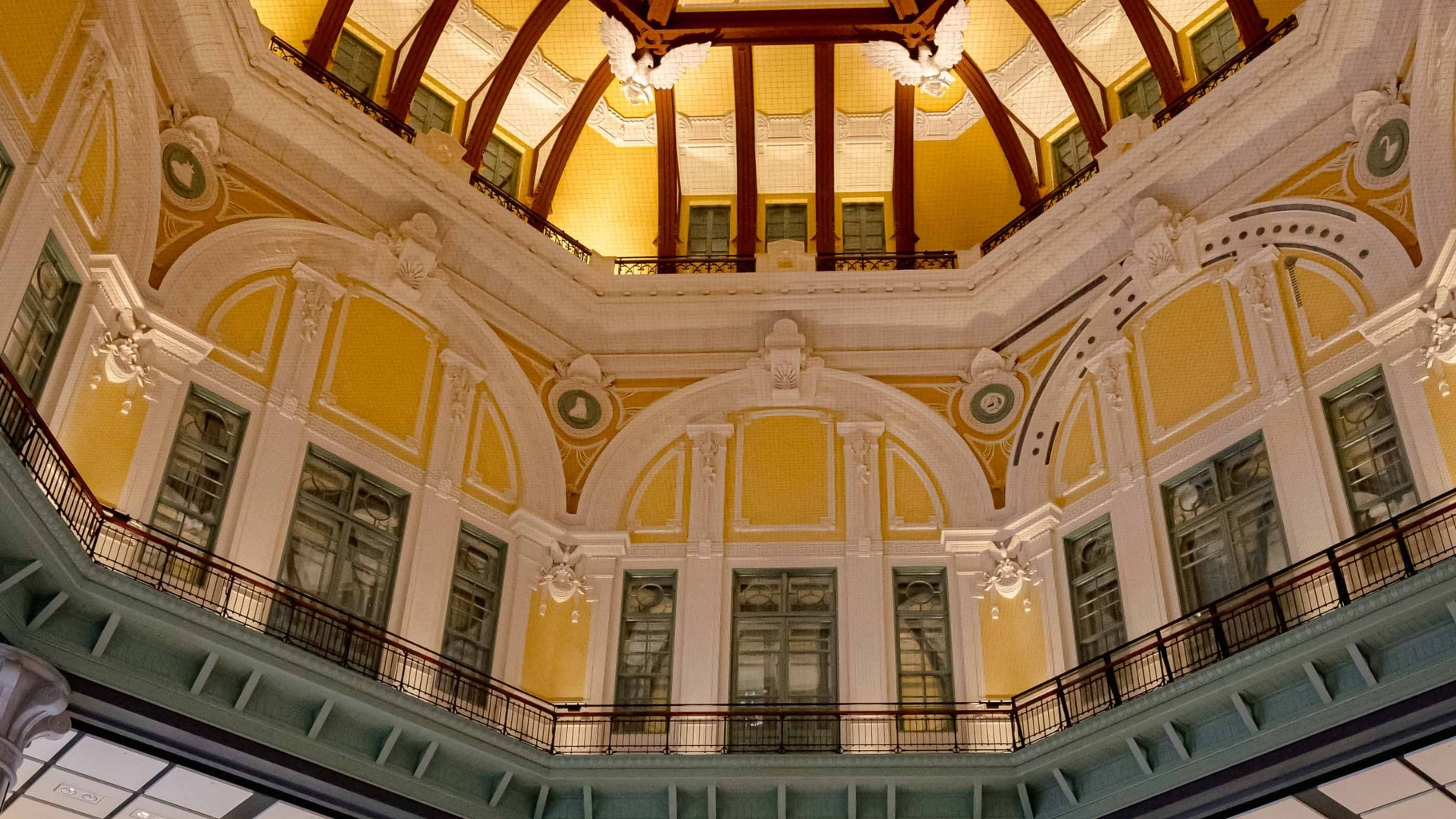 a yellow and white building with a balcony