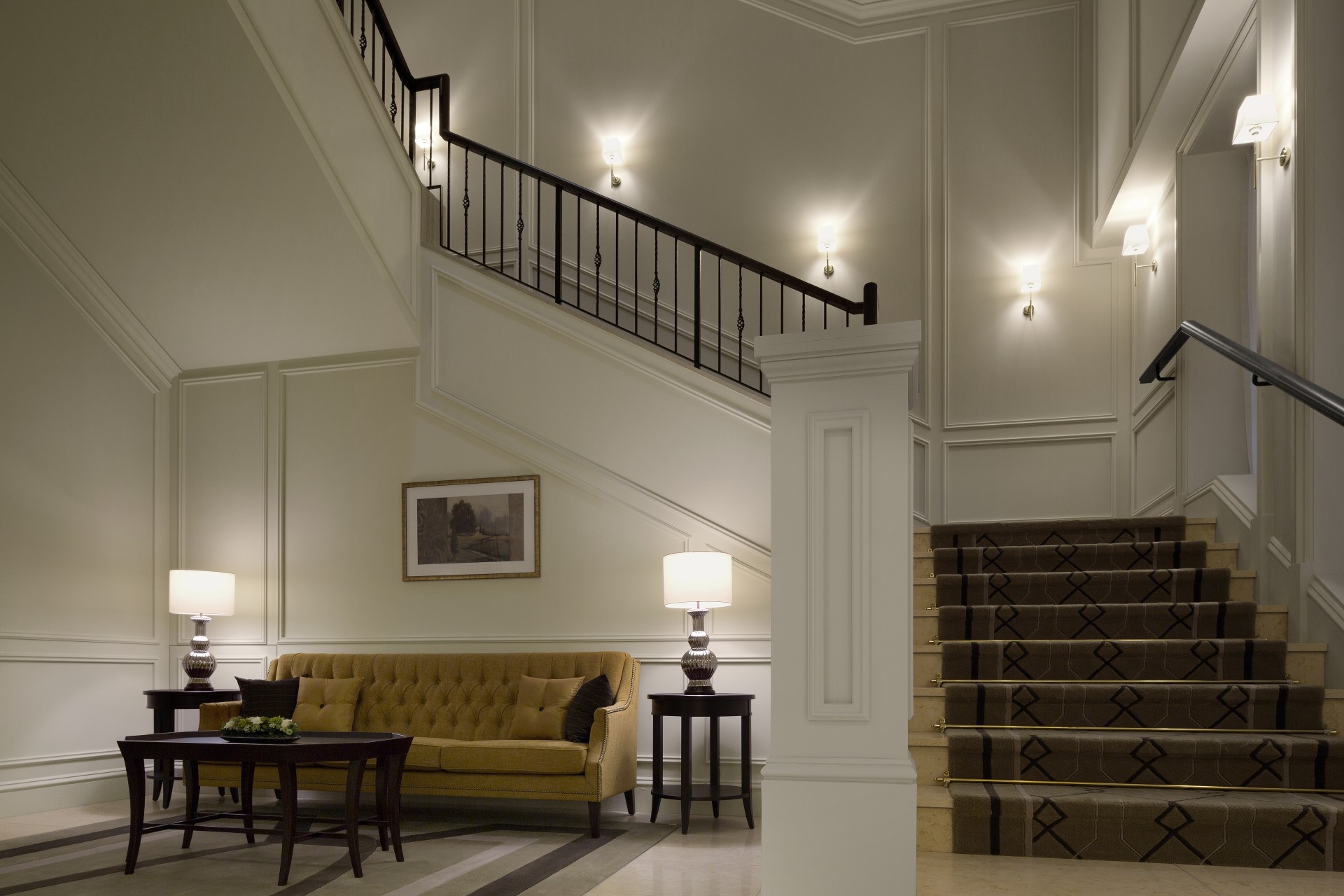a staircase with a couch and a table