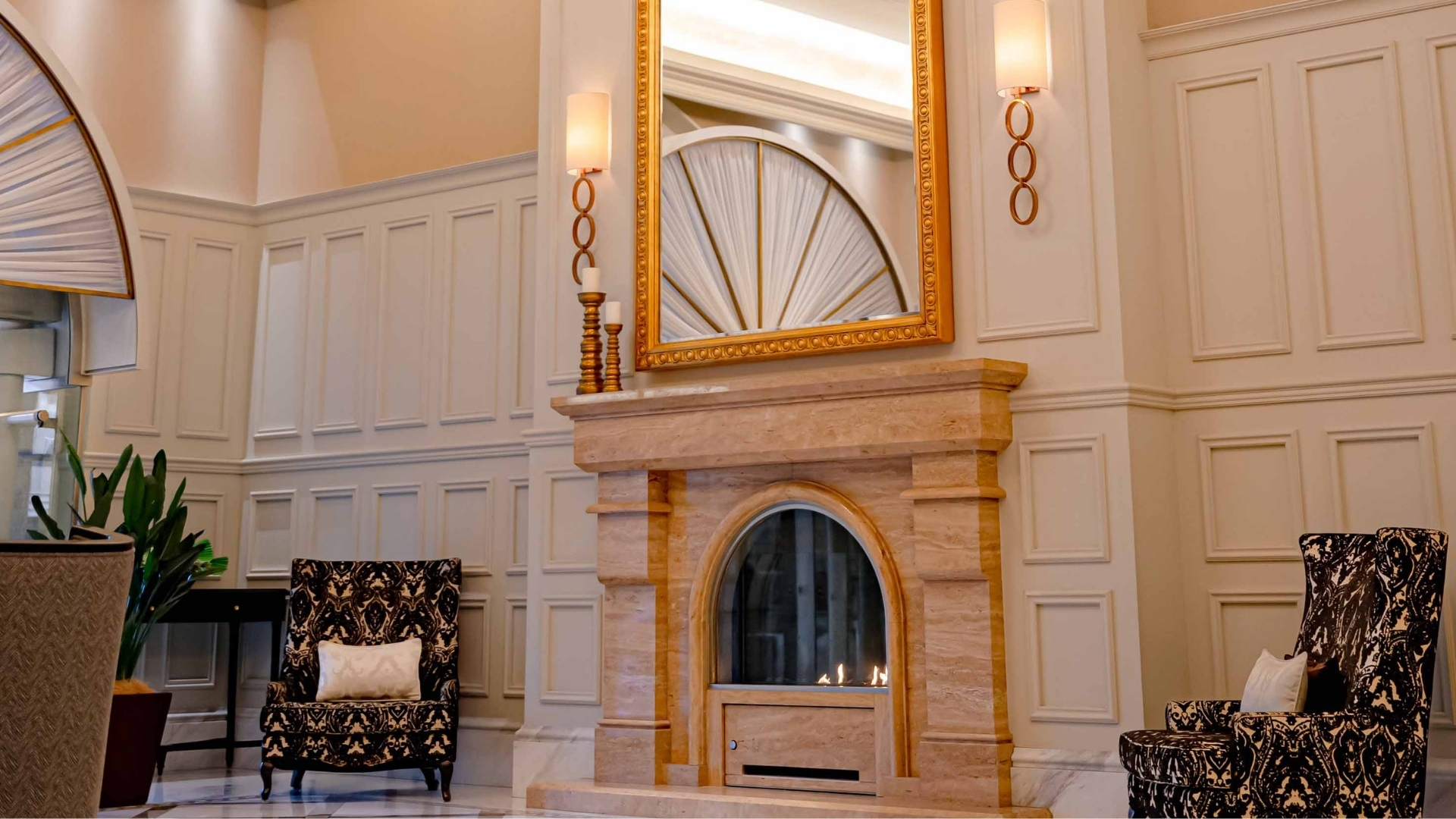 a mirror above a fireplace