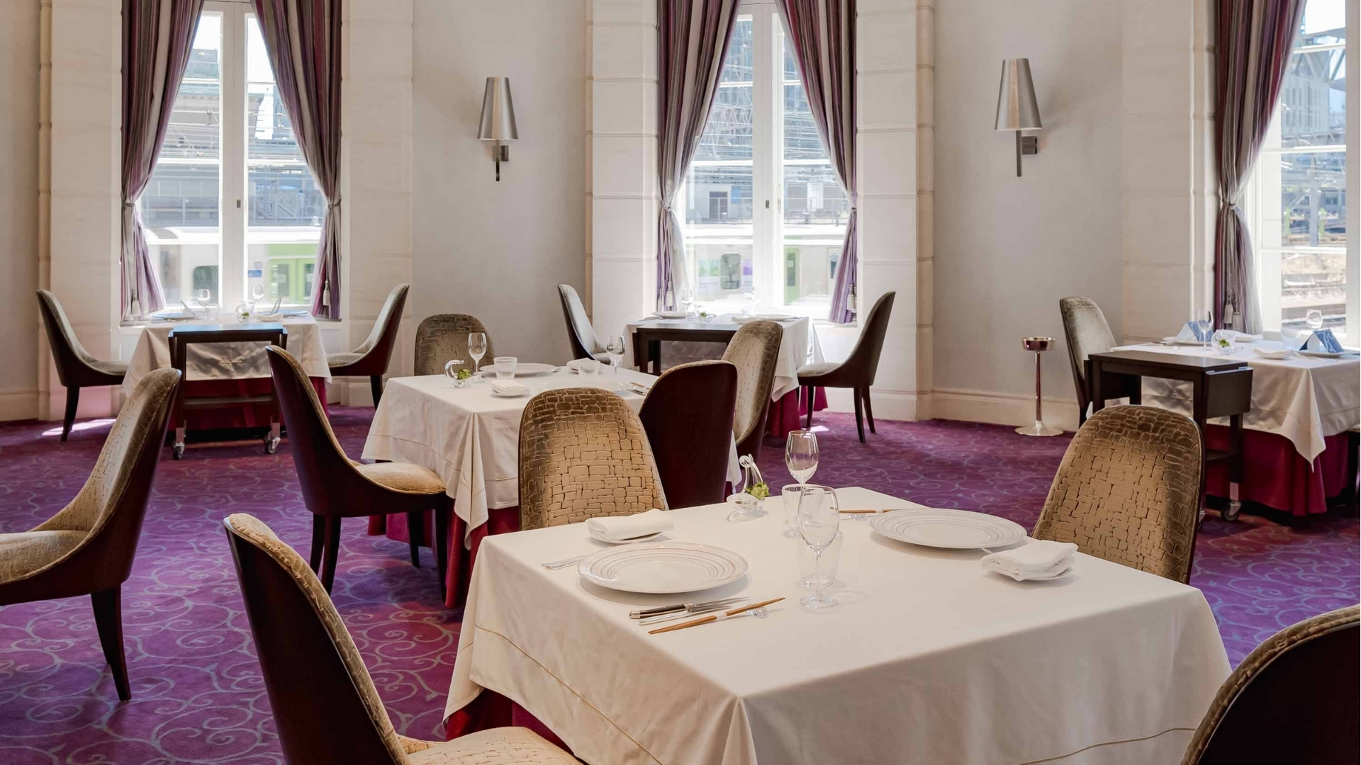 a restaurant with tables and chairs