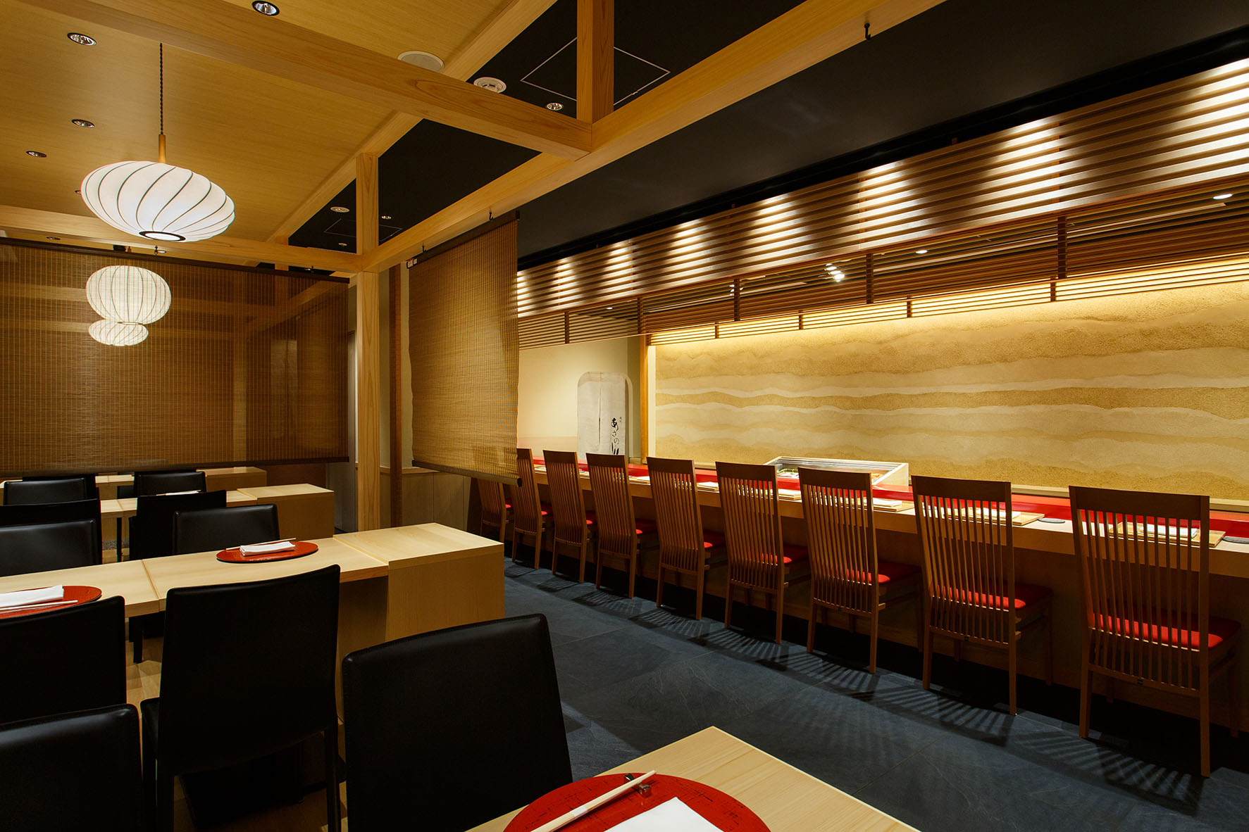 a room with a long table and chairs