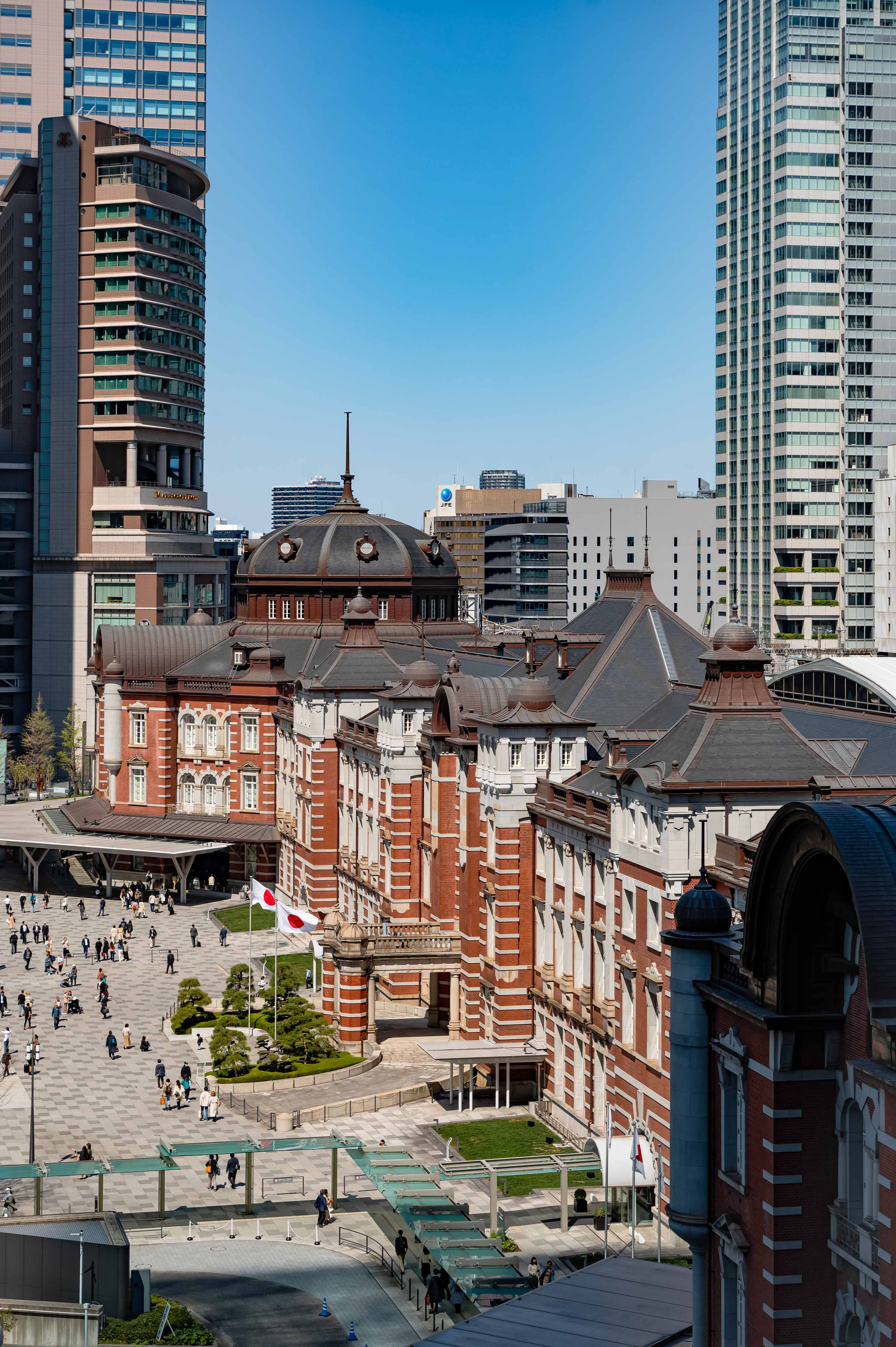 a large building with many people walking around