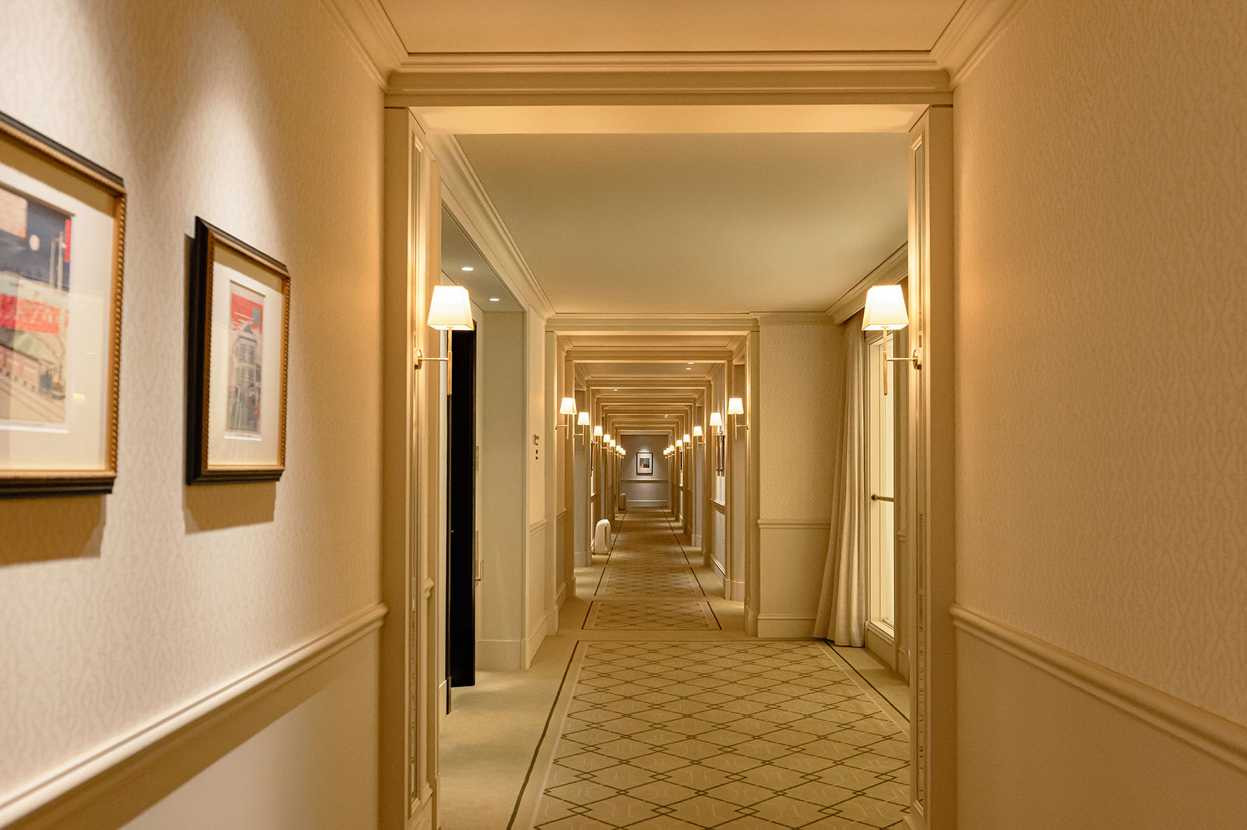 a hallway with lights on the walls