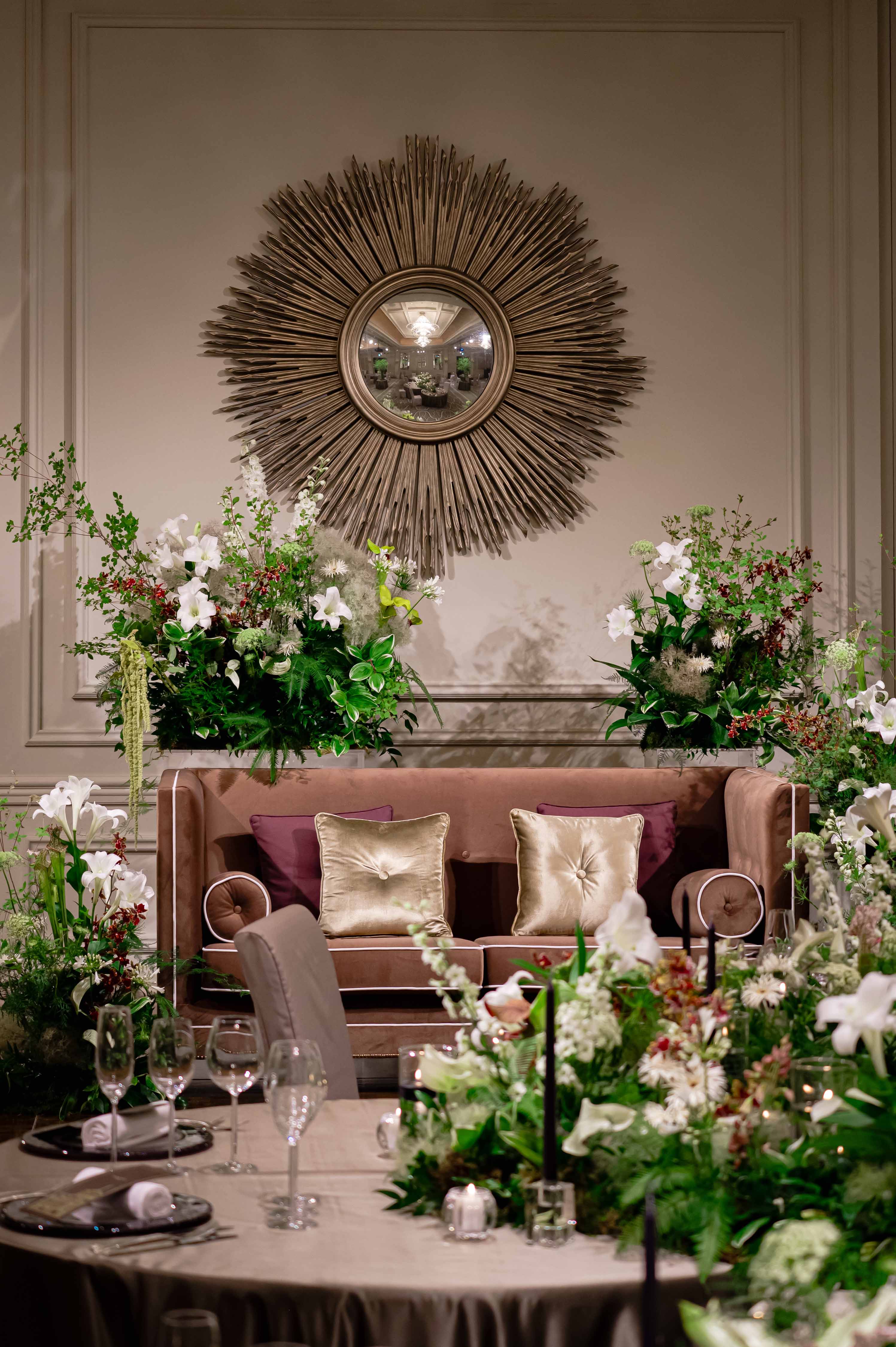 a room with a couch and flowers
