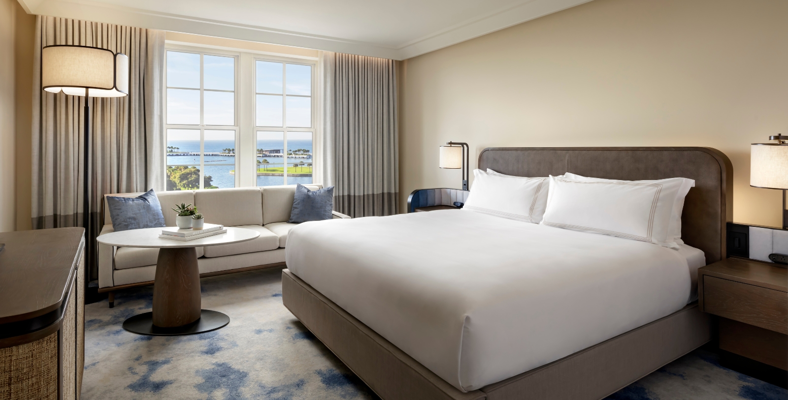 a room with a large bed and a couch